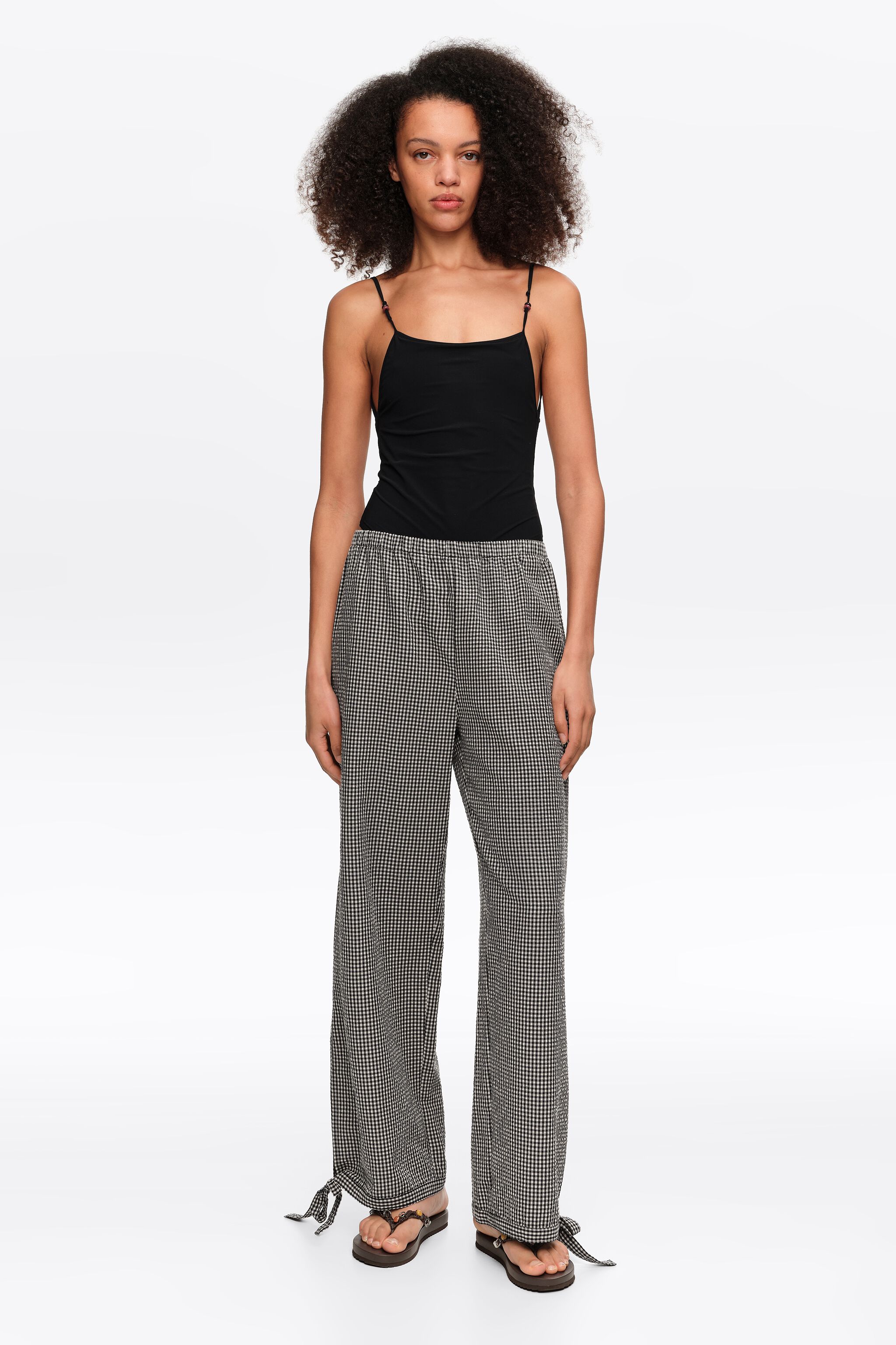 Black checked trousers with adjustable ankles