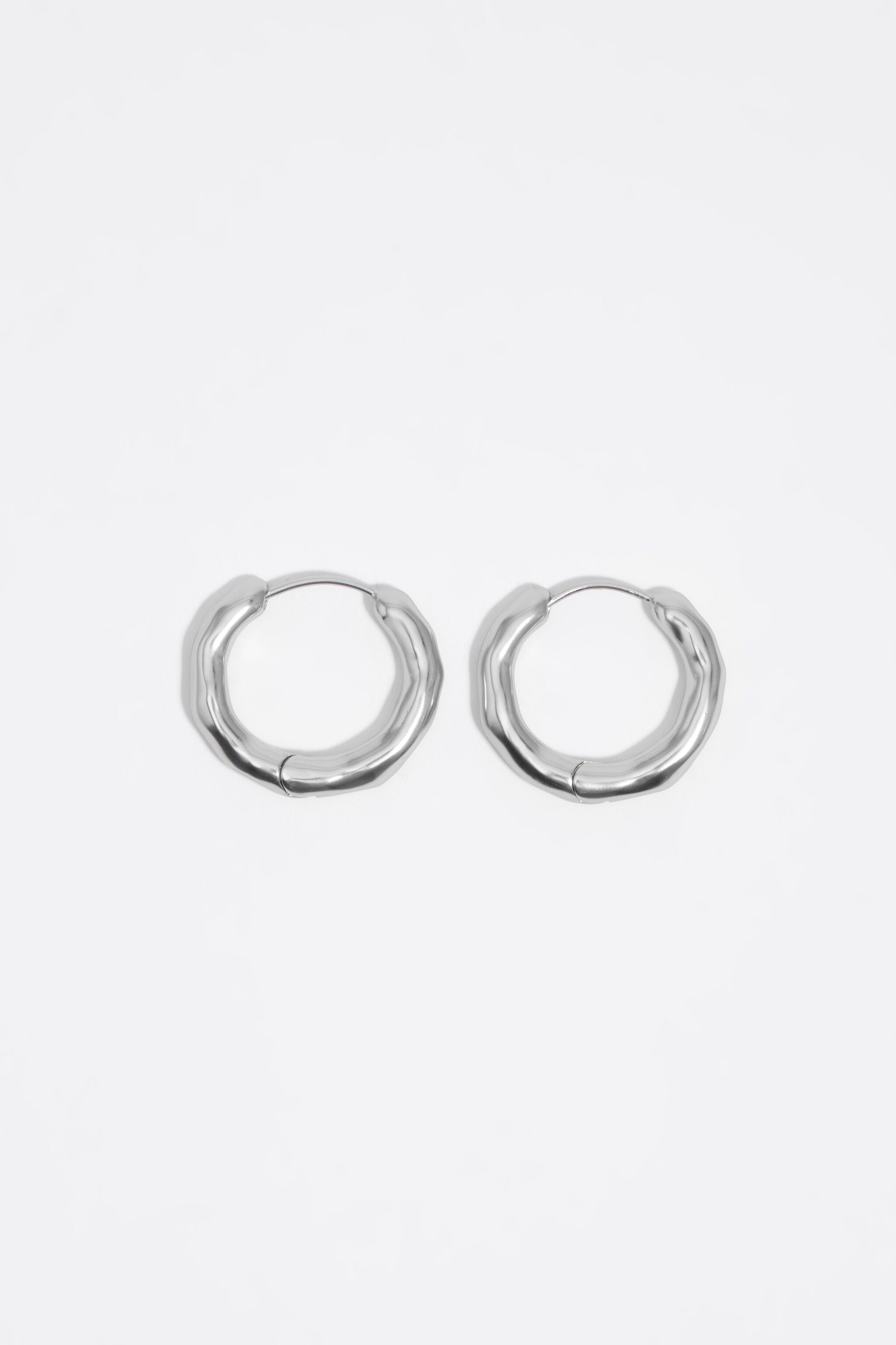 Silver irregular hoop earrings
