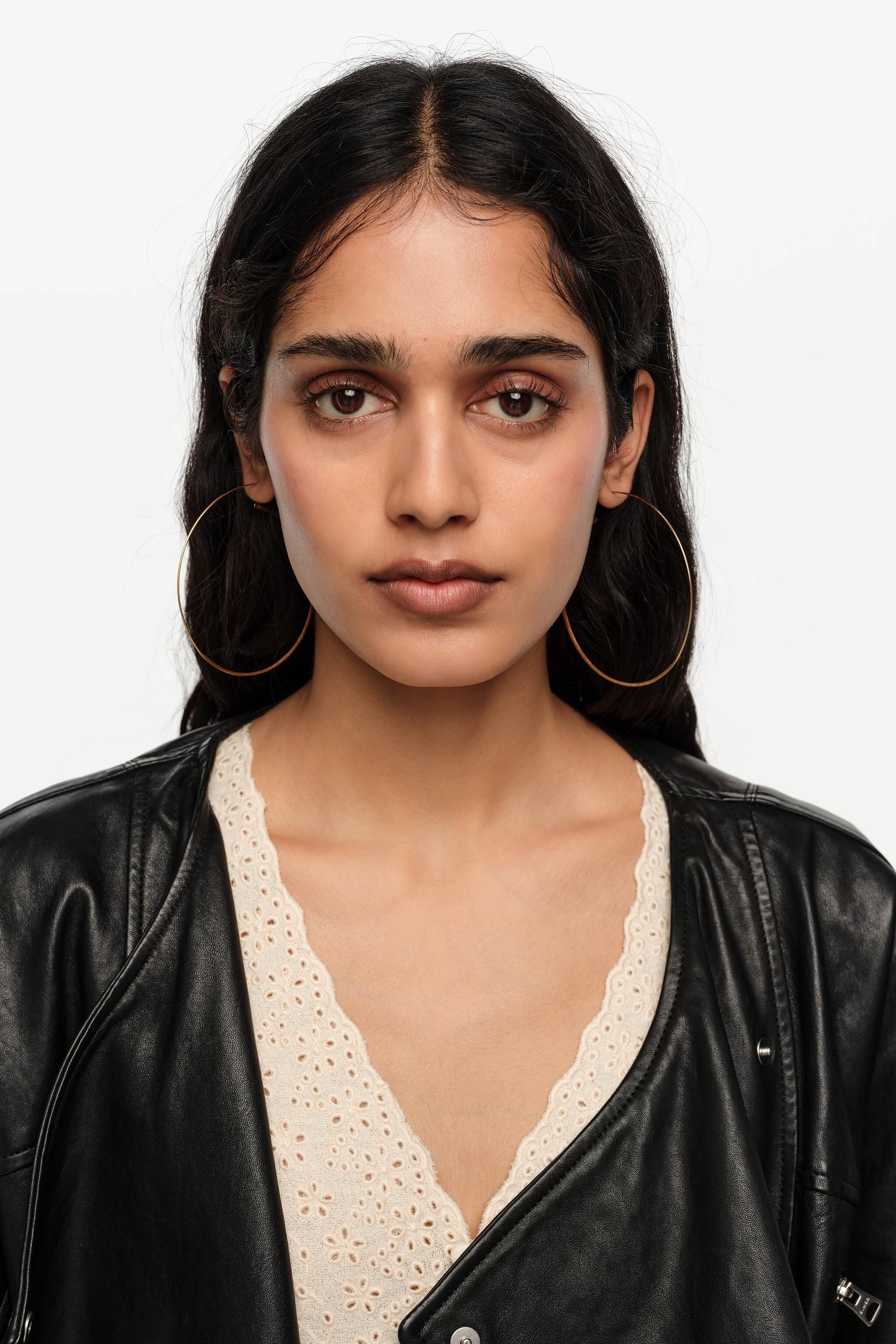 Large aged gold textured hoop earrings