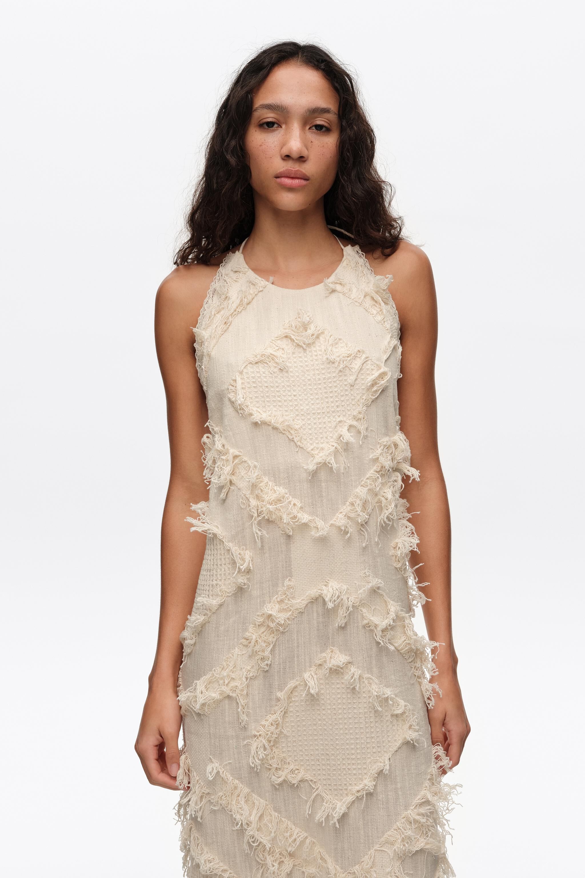 Ivory halter neck dress with fringing