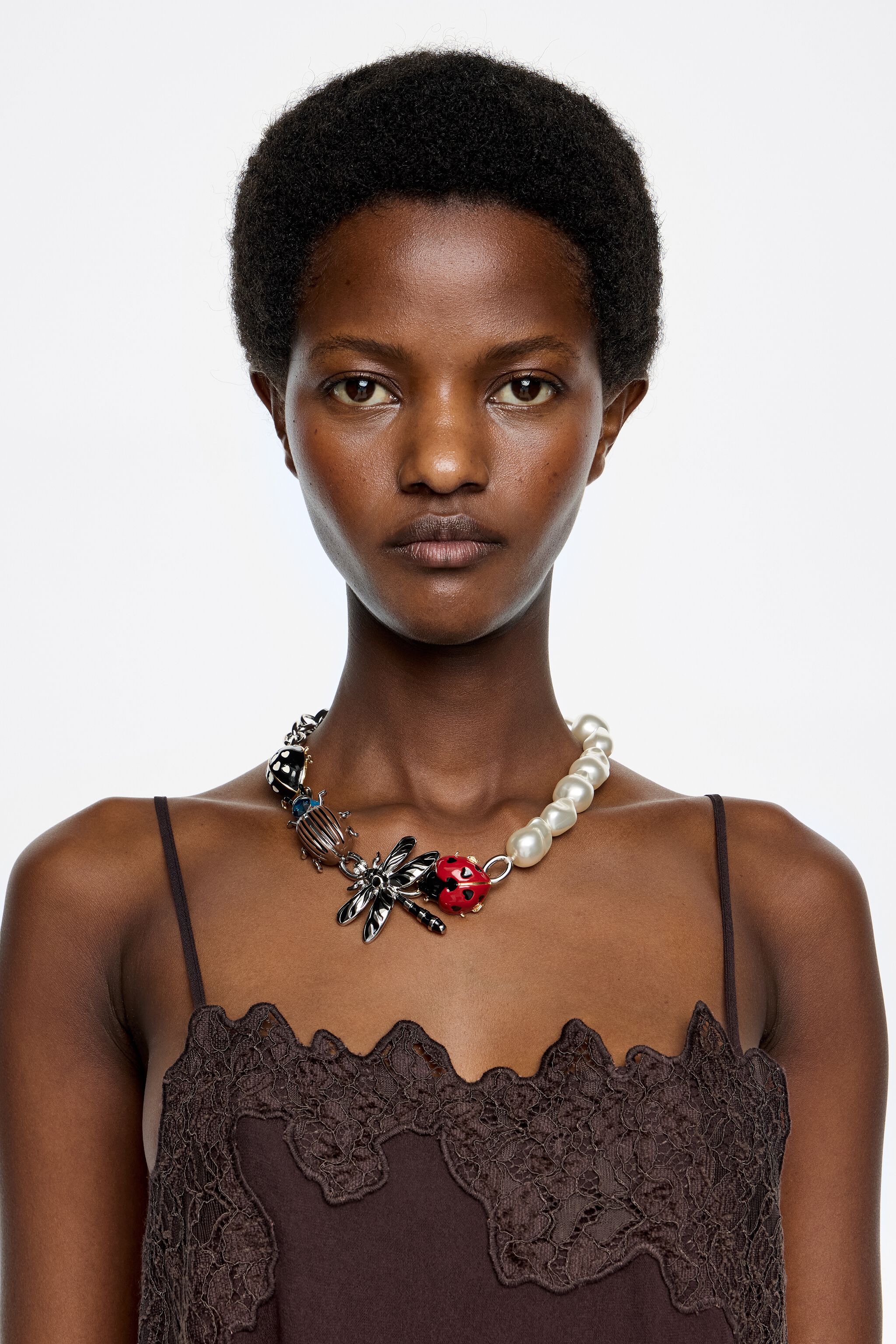Silver chain and pearl necklace with beetle and dragonfly