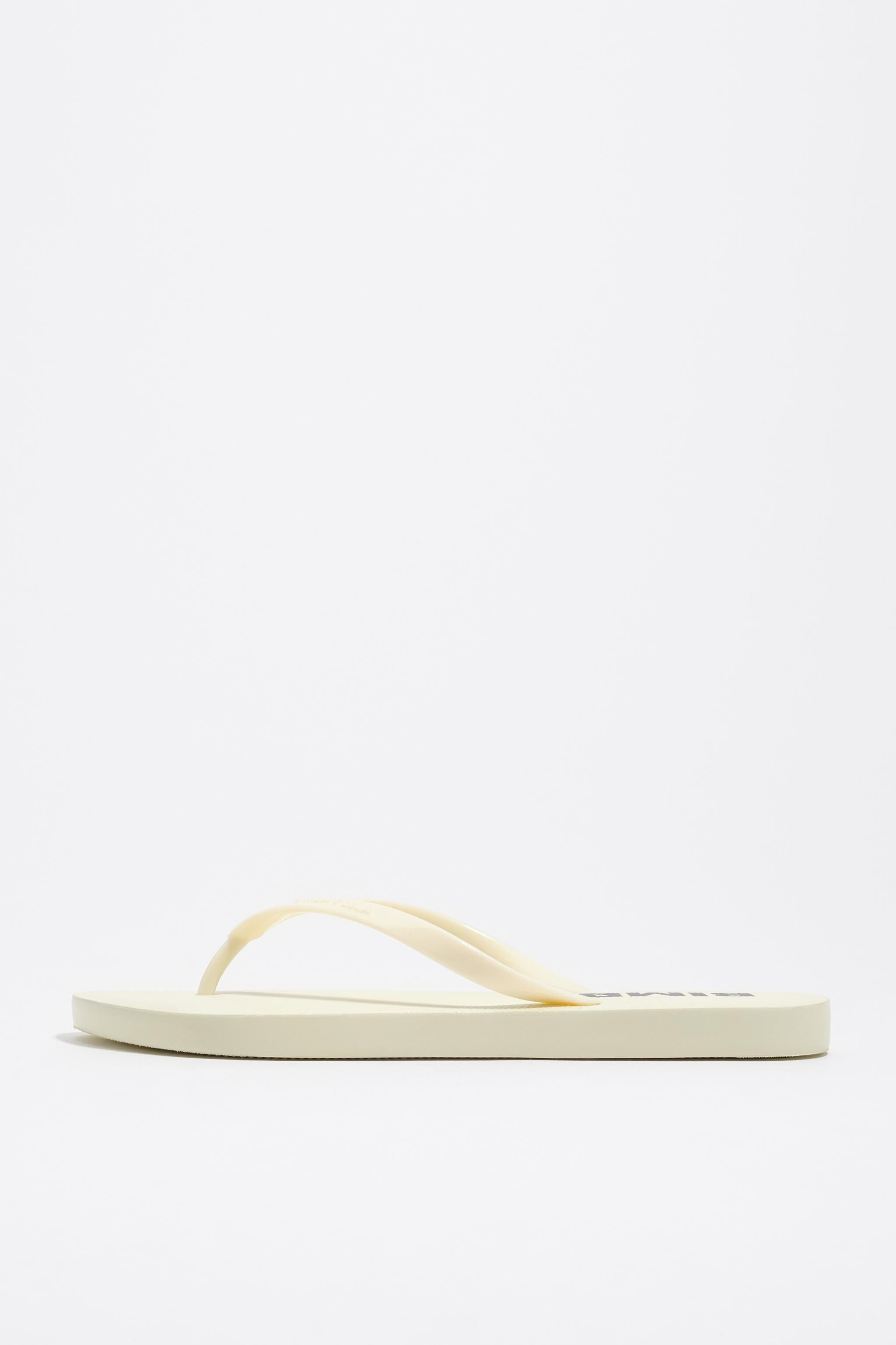 Ivory flip-flop