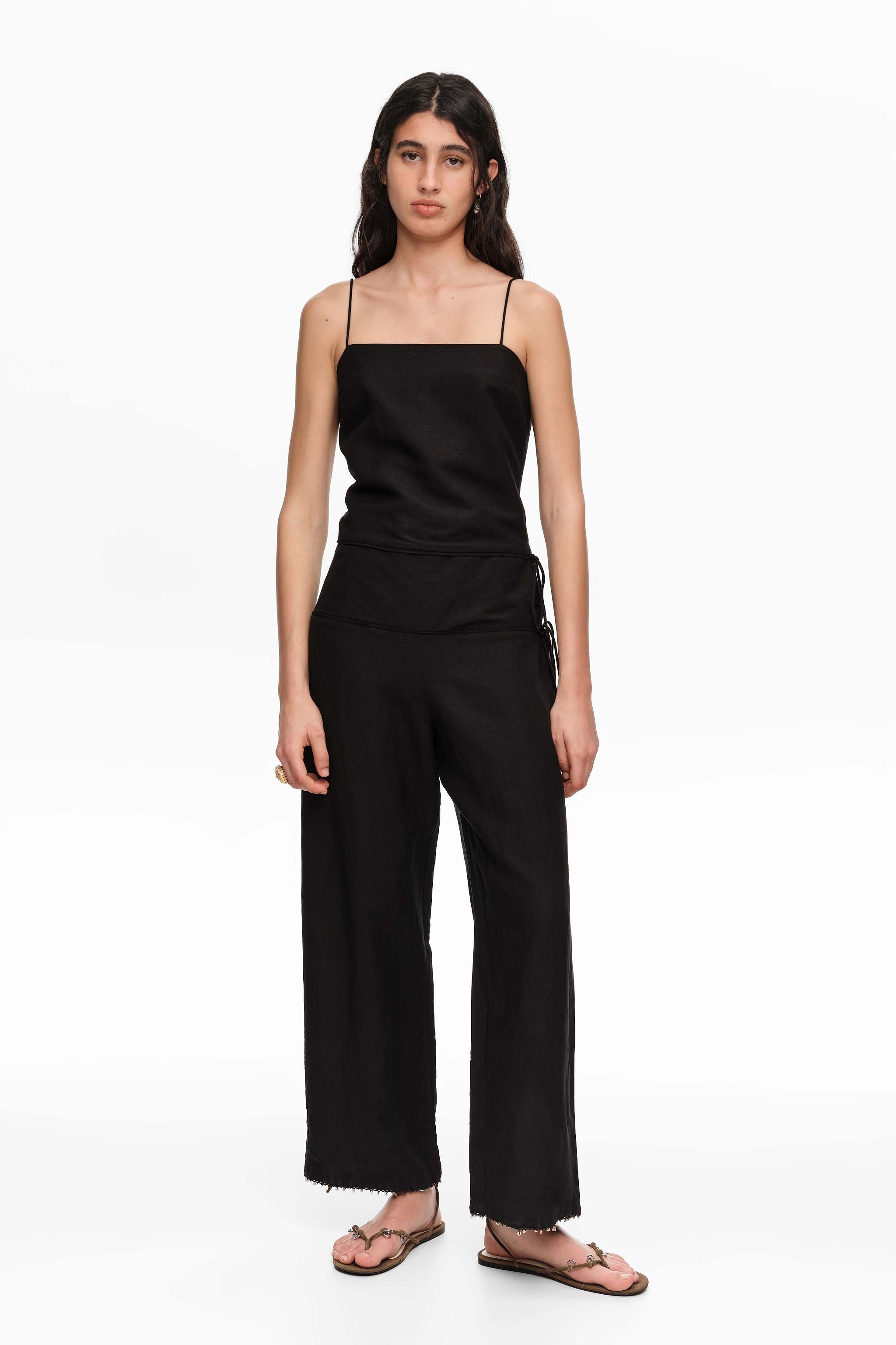 Black linen jumpsuit with adjustable waist and stones