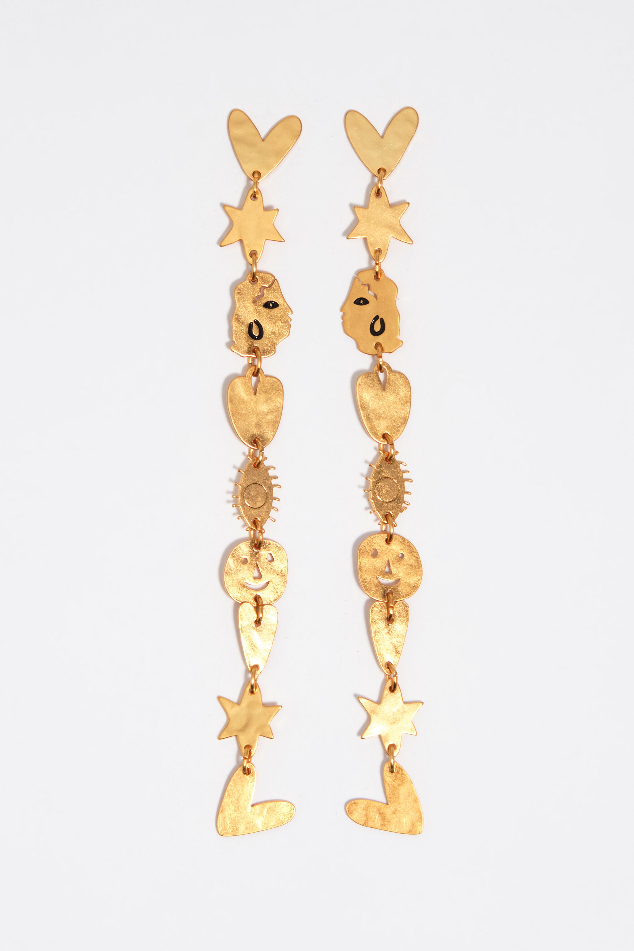 Matte gold metal silhouette earrings