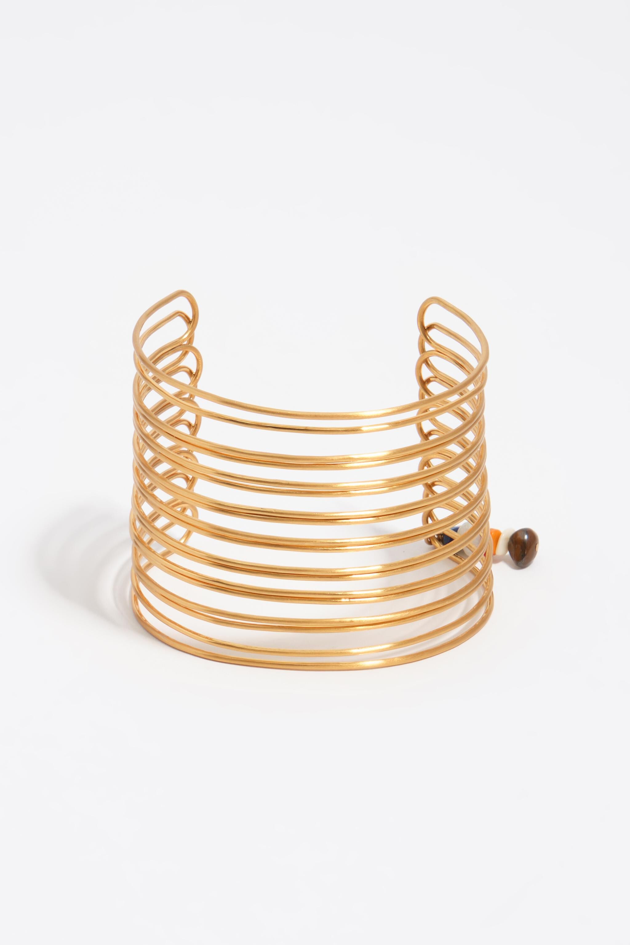 Forearm bracelet with bands in aged gold texture