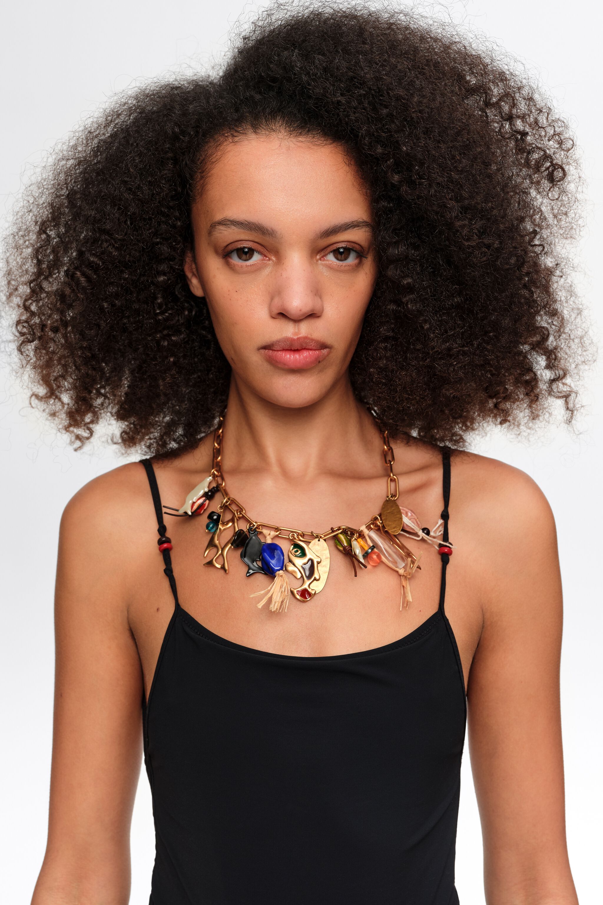 Necklace with aged gold fish and ceramics