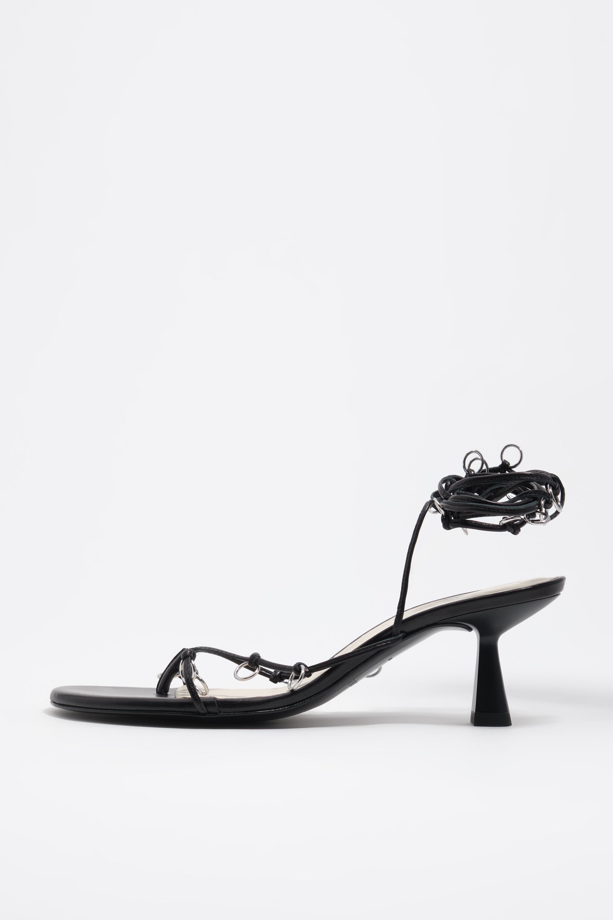 Black leather heeled sandal with piercings