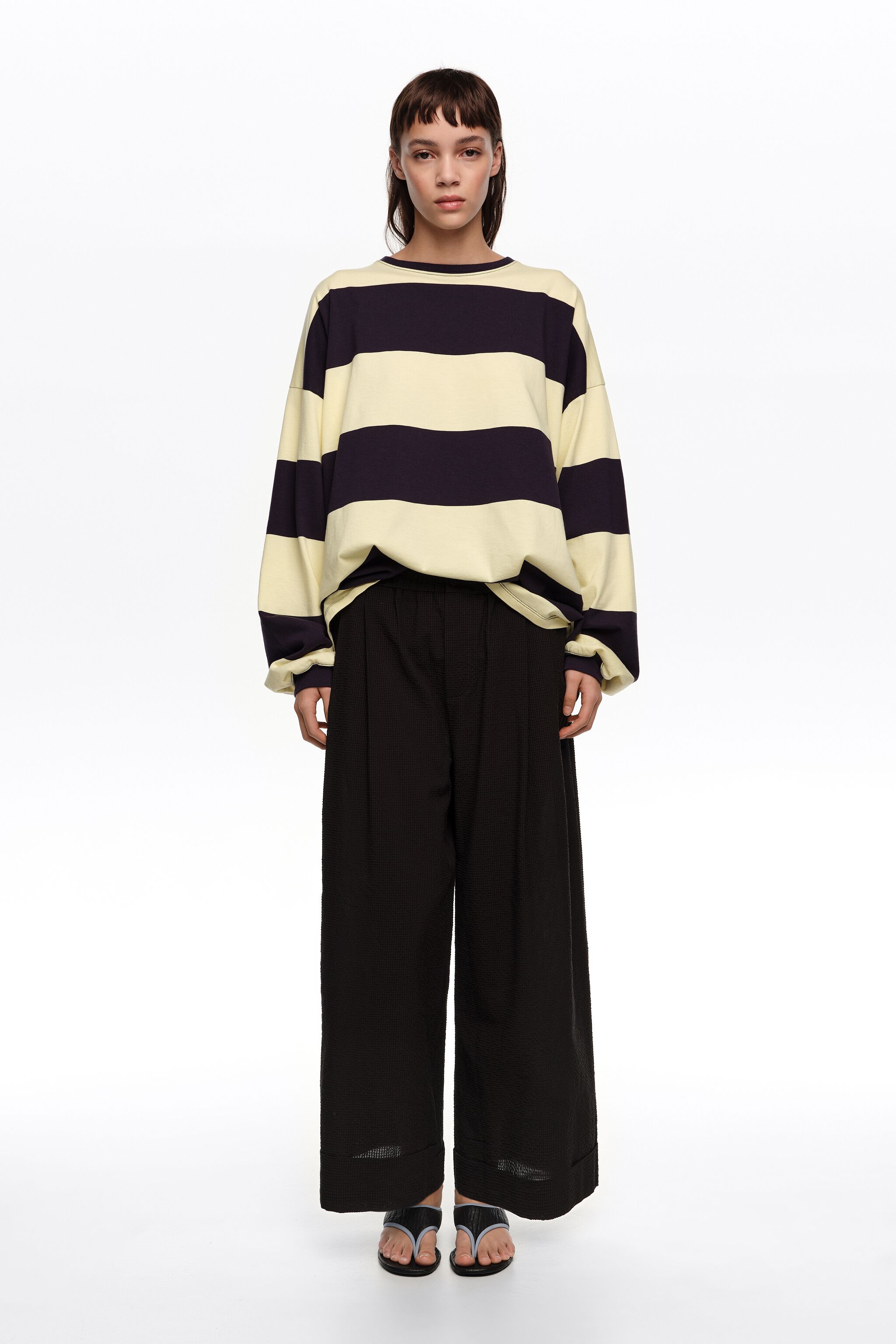 Black textured bell-bottom trousers
