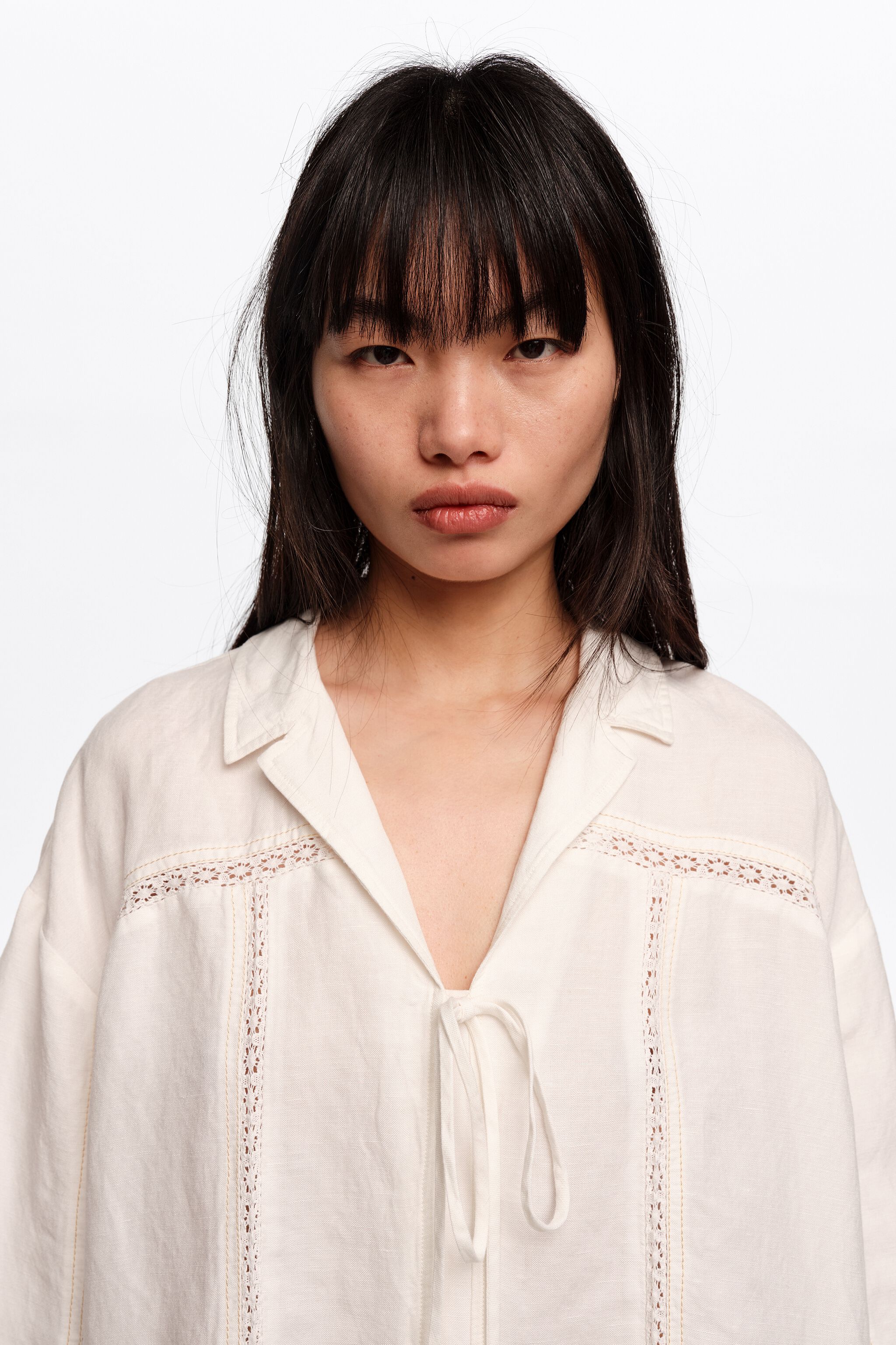 White linen shirt with ties and lace