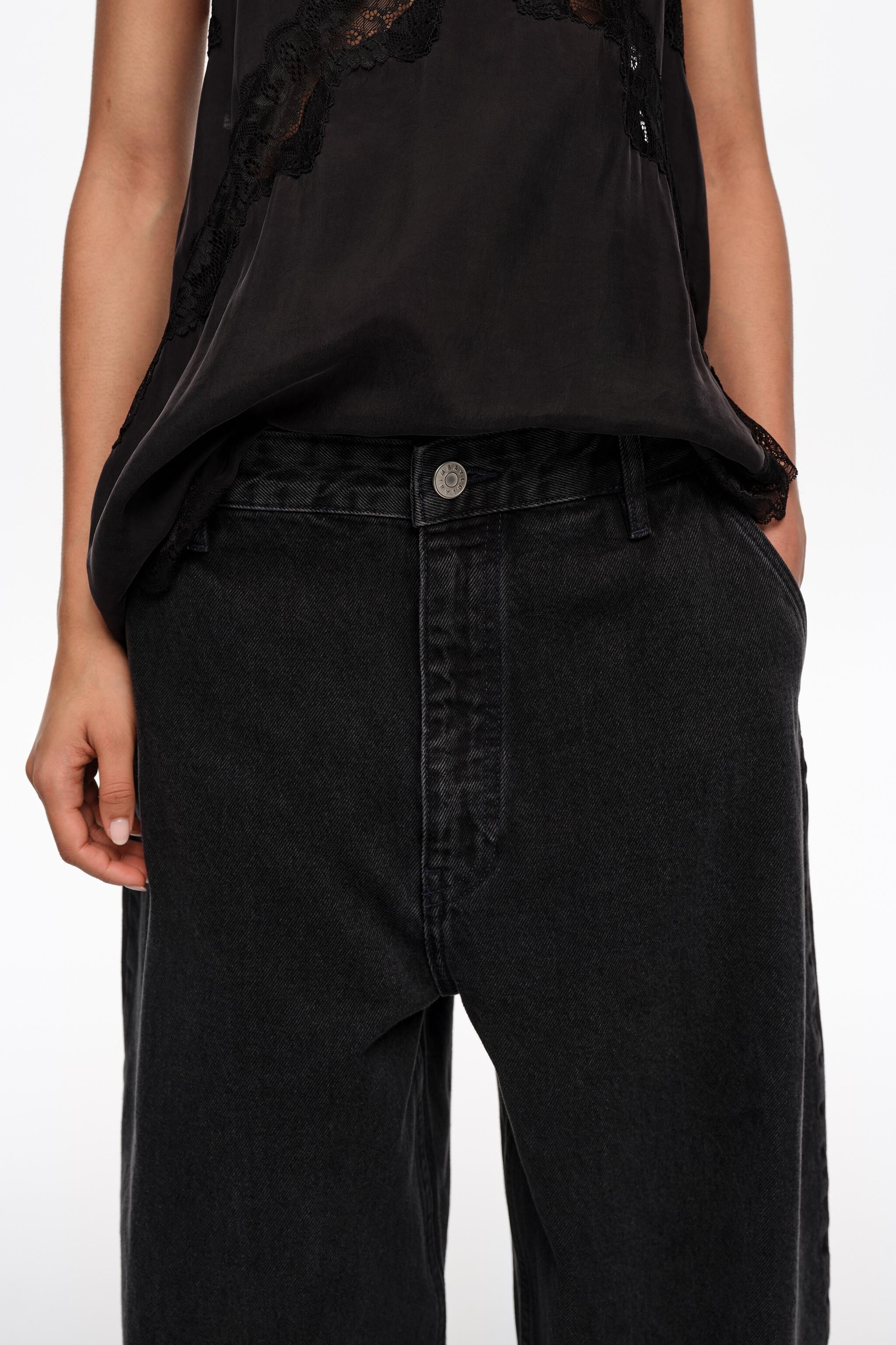 WIDE LEG - Washed black denim trousers