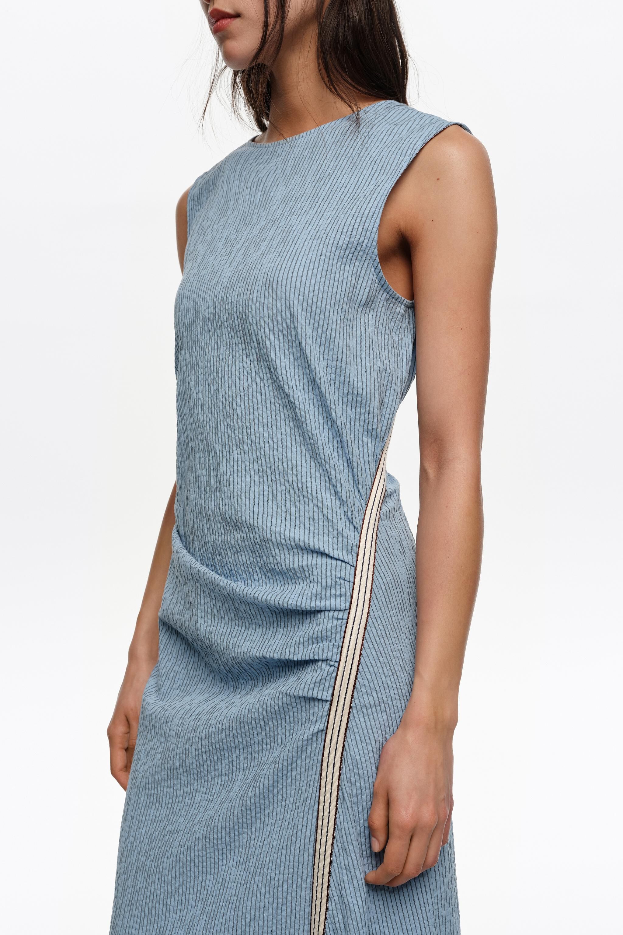 Sleeveless dress with blue striped overlay strap