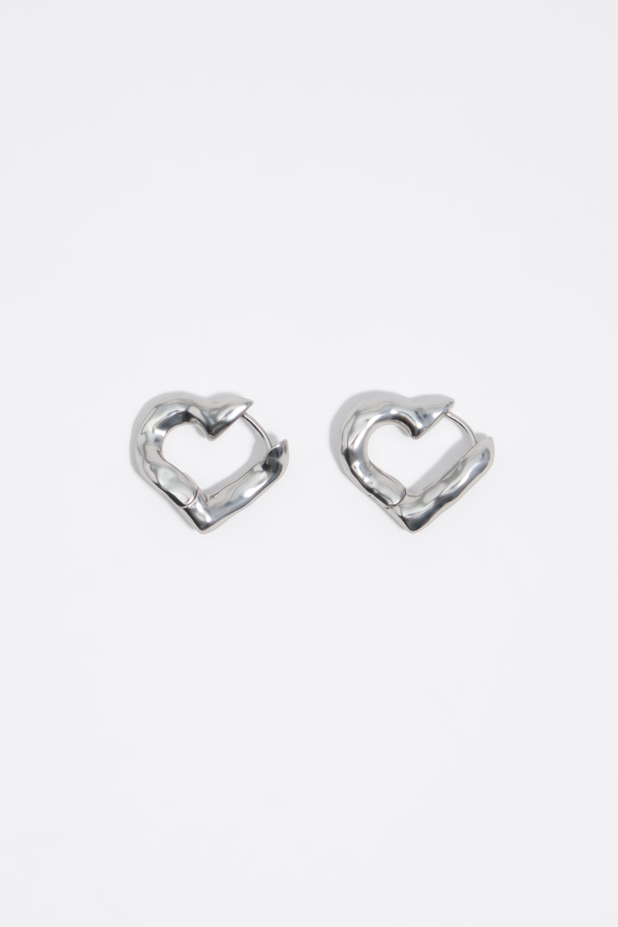 Textured silver heart hoop earrings