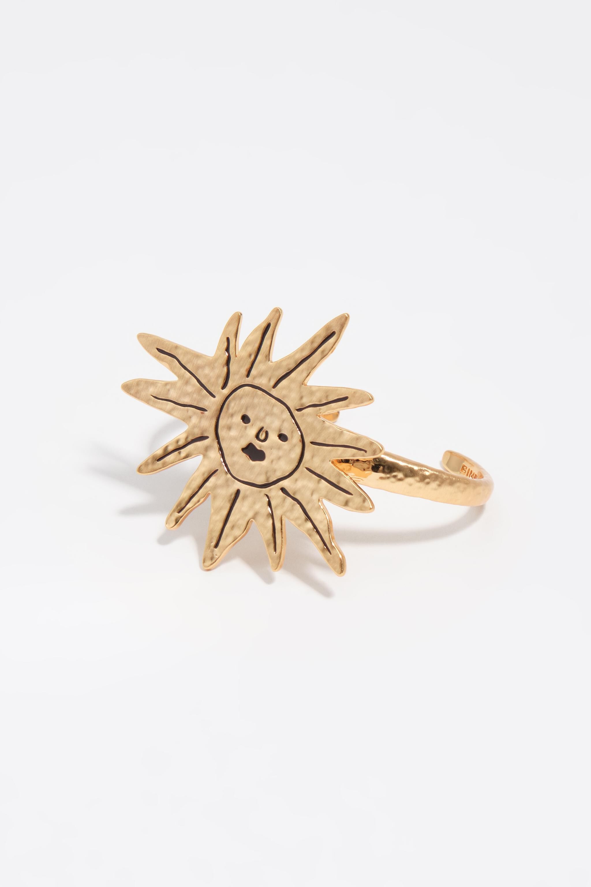 Sun bracelet with brushed gold texture