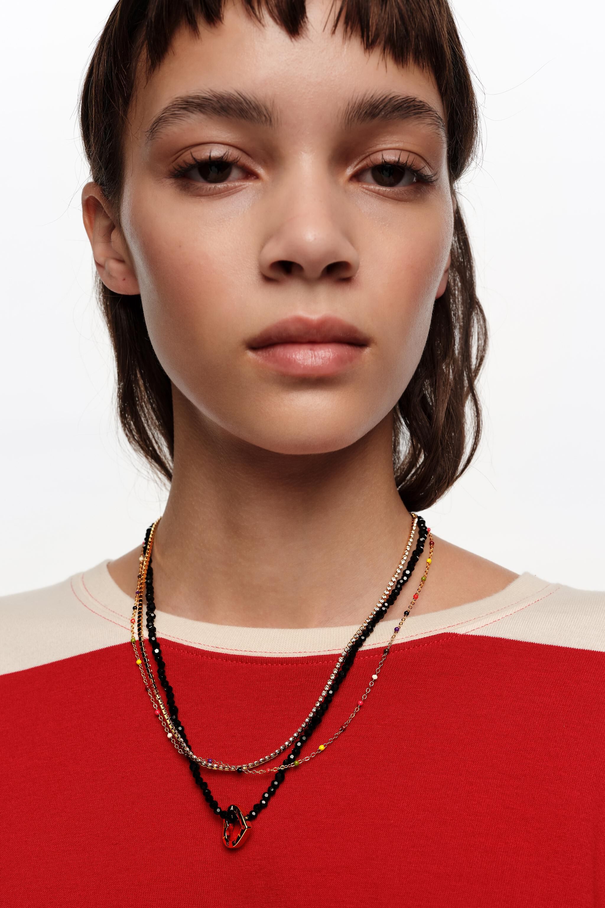 Double necklace with black crystals and heart logo