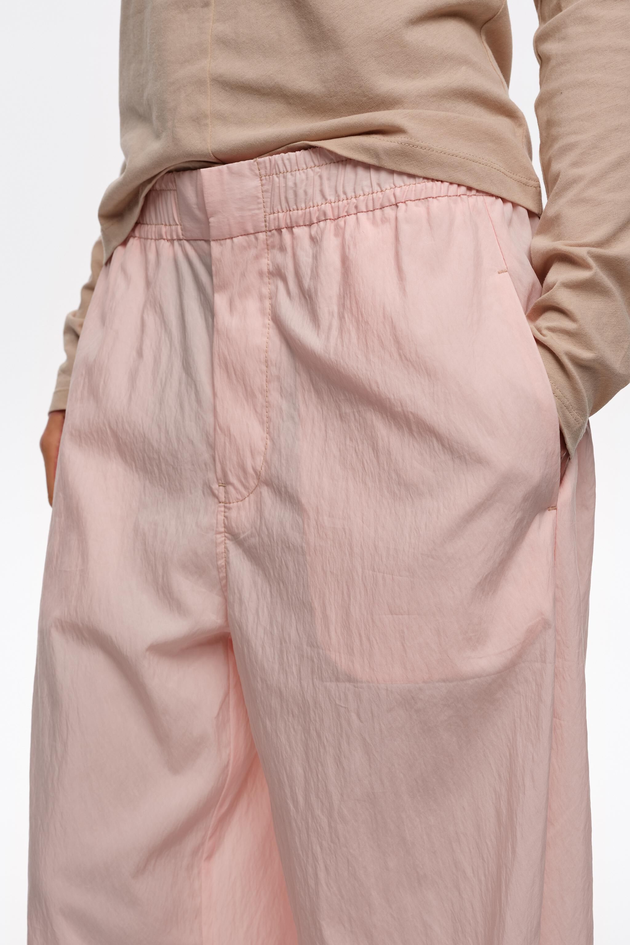 Light pink gathered jogger trousers