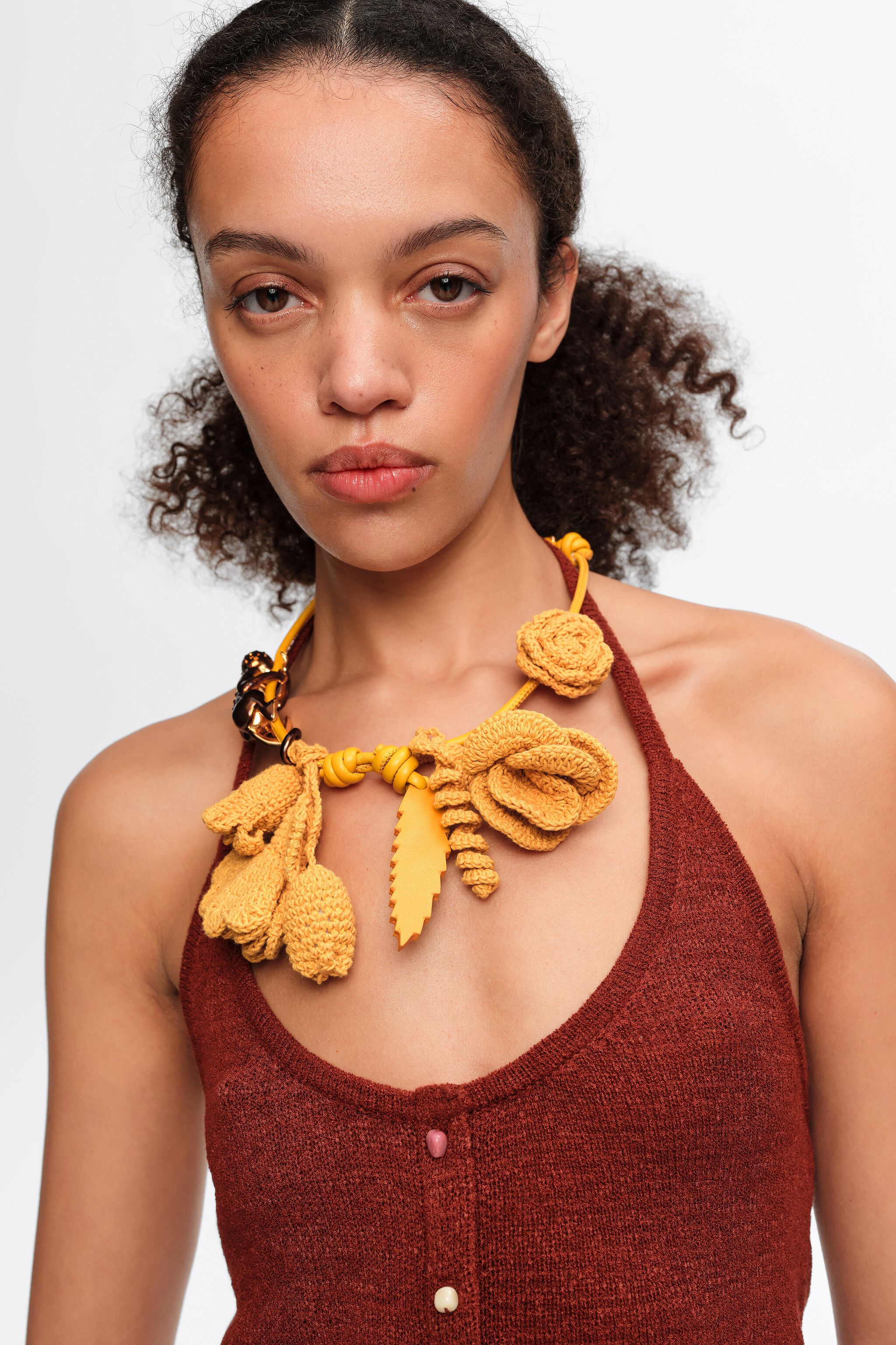 Mustard monkey and crochet flowers necklace