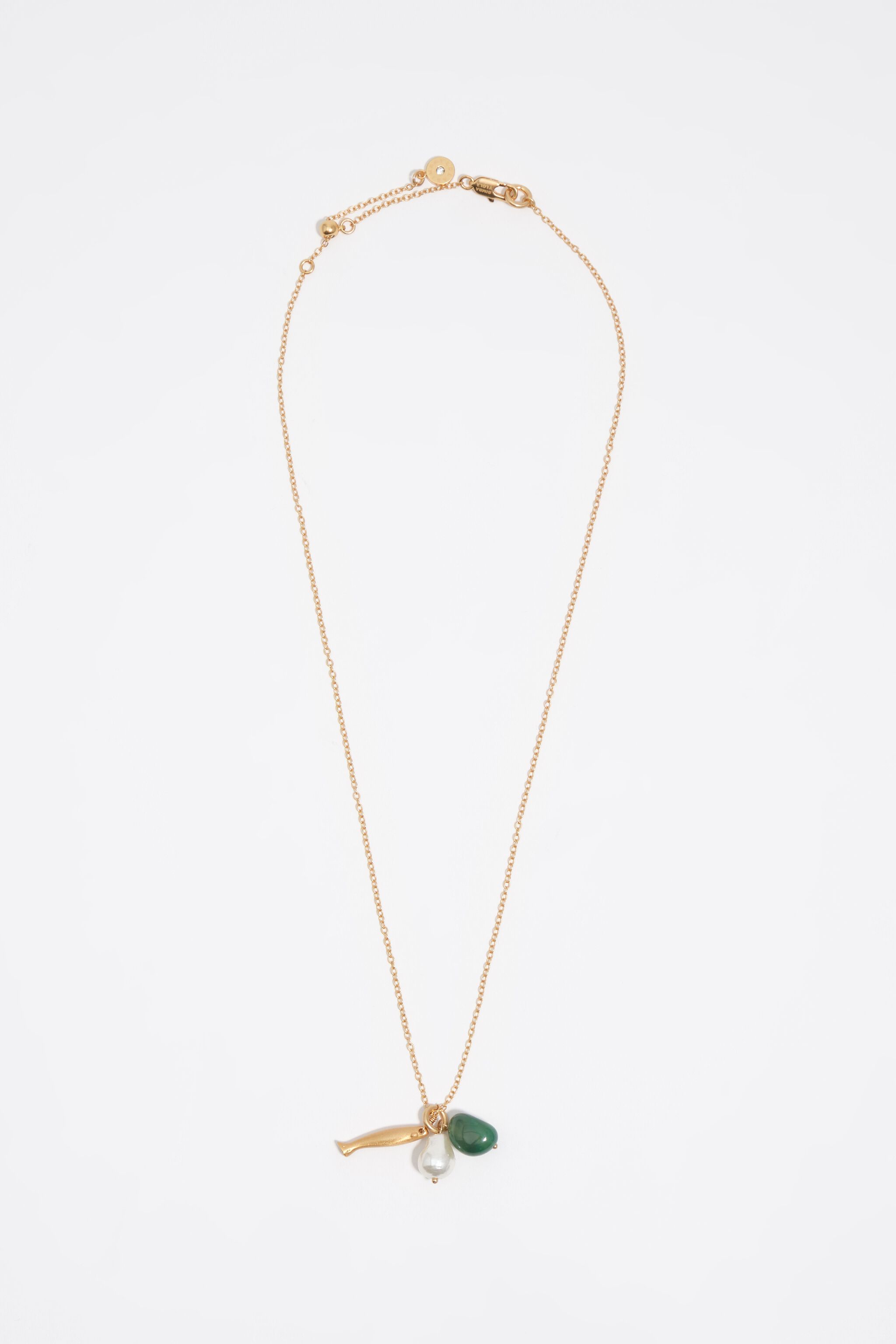 Aged gold necklace with fish and stone