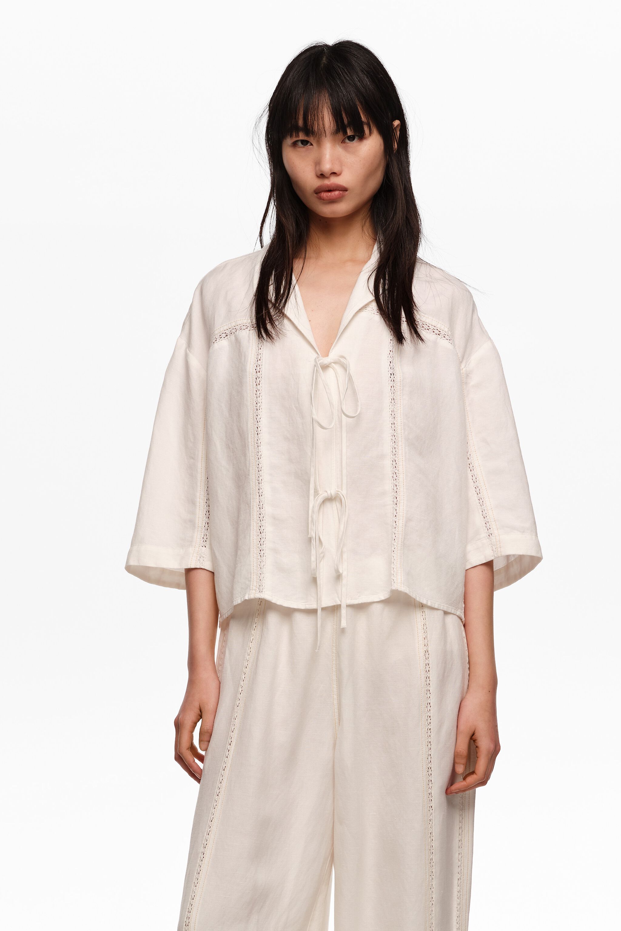 White linen shirt with ties and lace