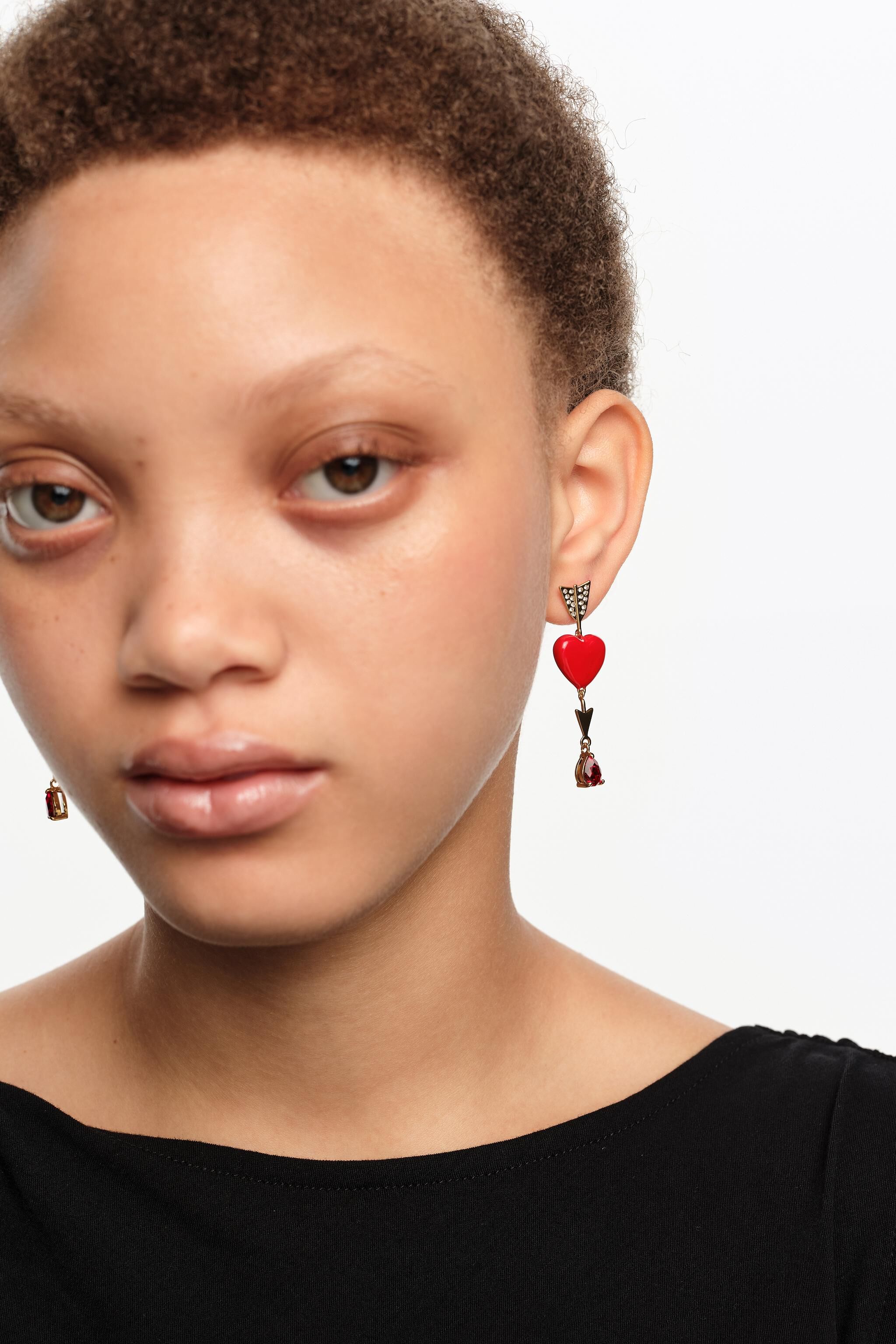 Gold heart and arrow earrings