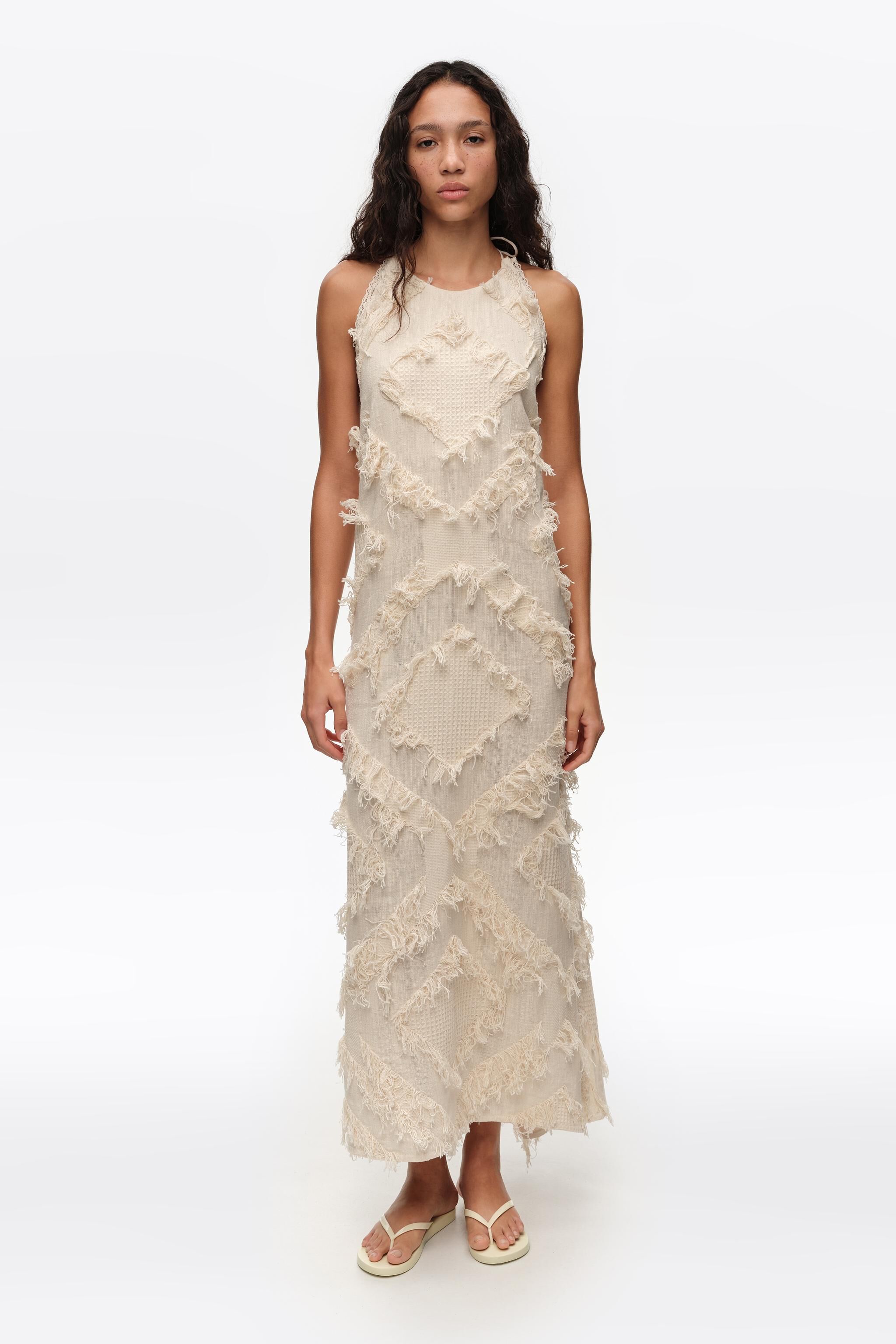 Ivory halter neck dress with fringing