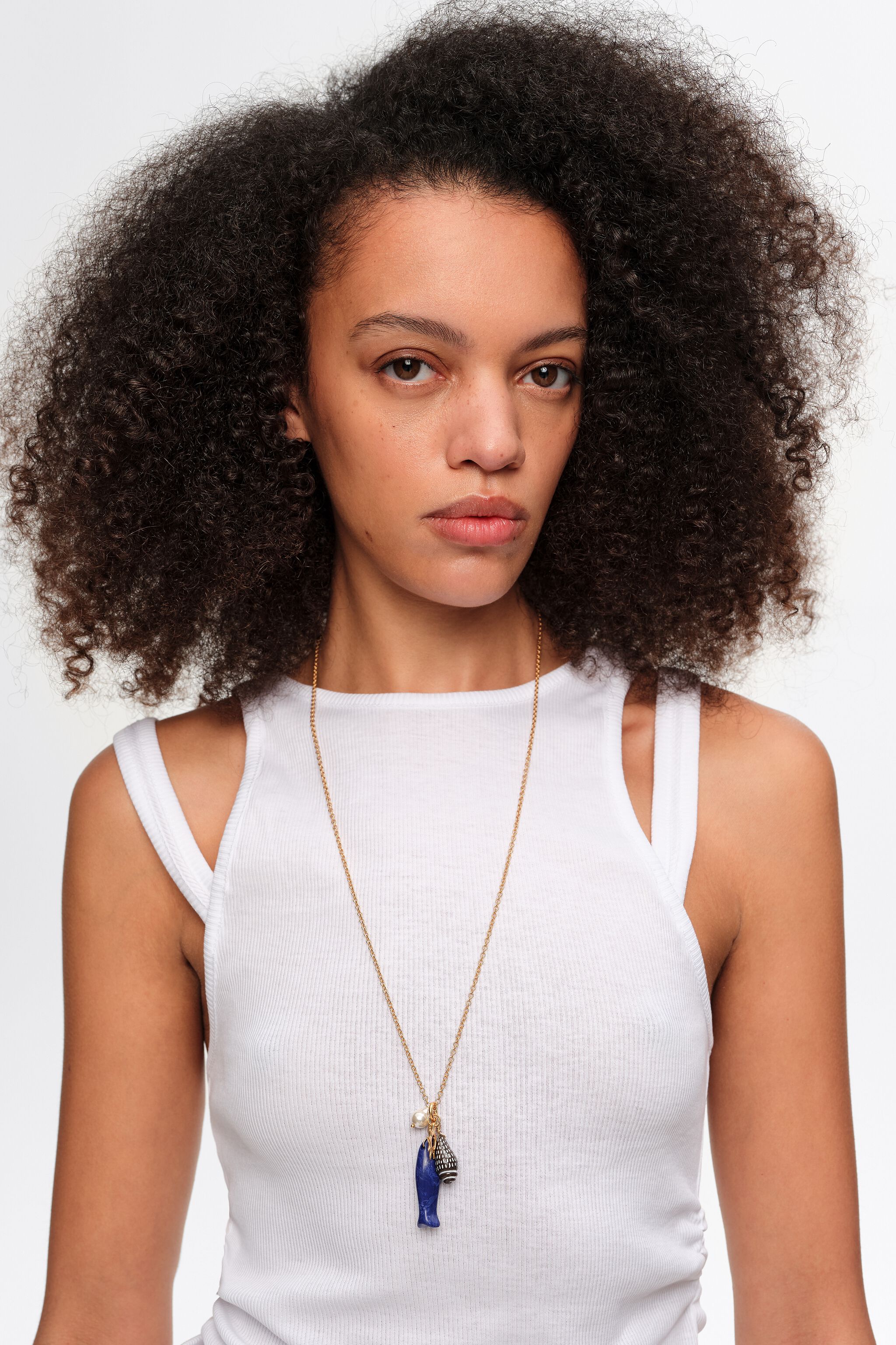 Aged gold necklace with fish and seashells