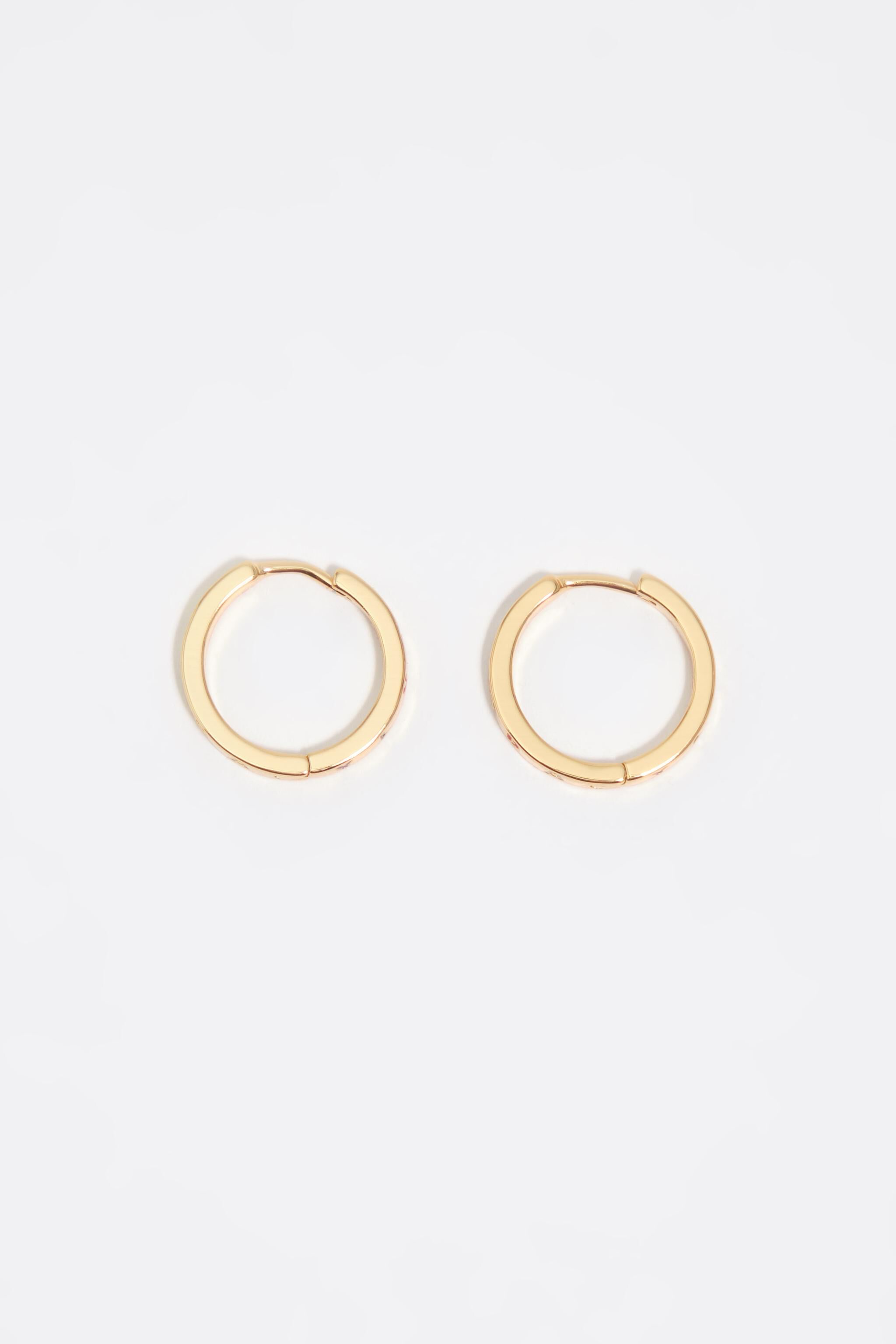 Gold hoop earrings with multicolor logo