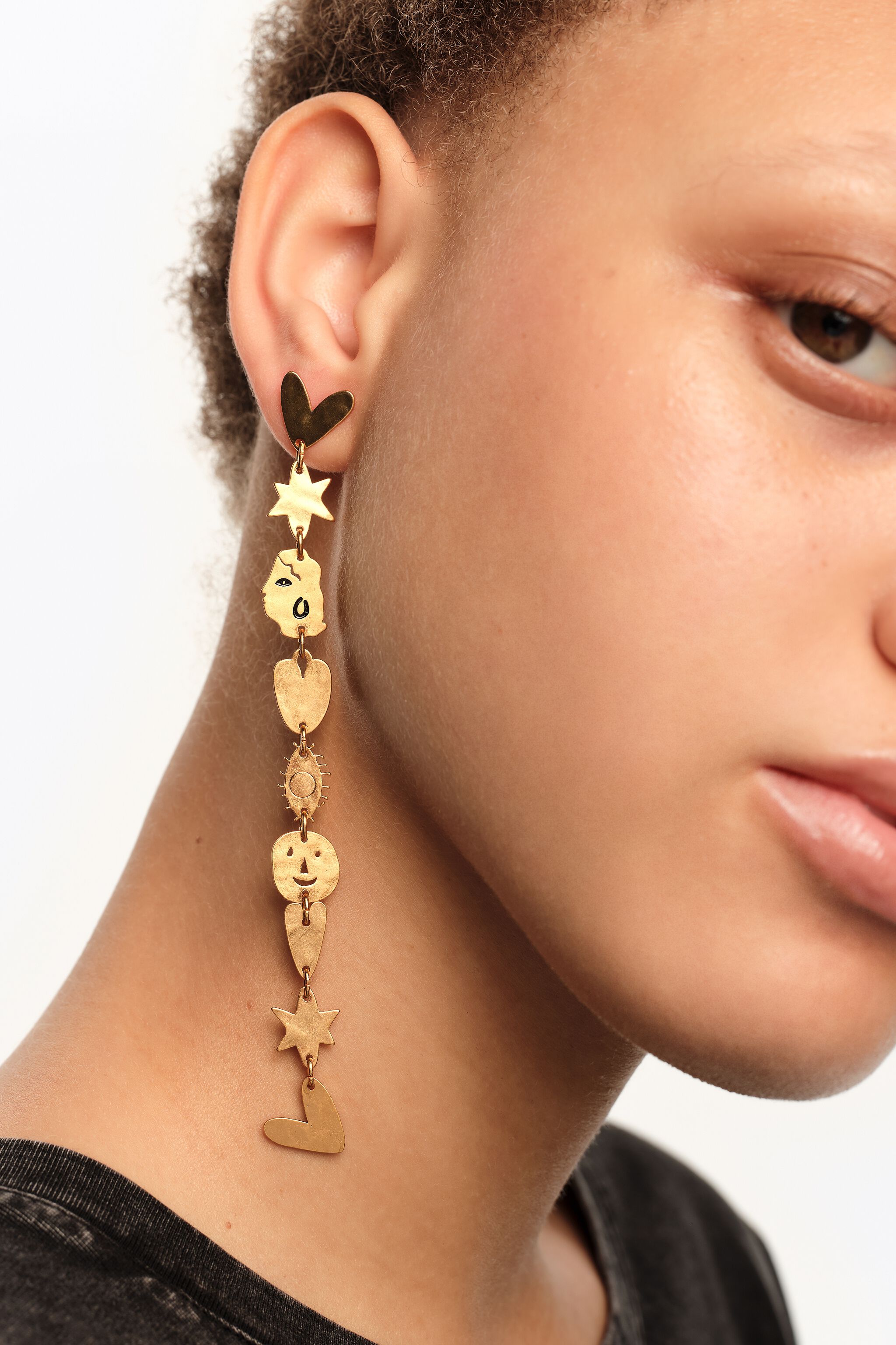 Matte gold metal silhouette earrings