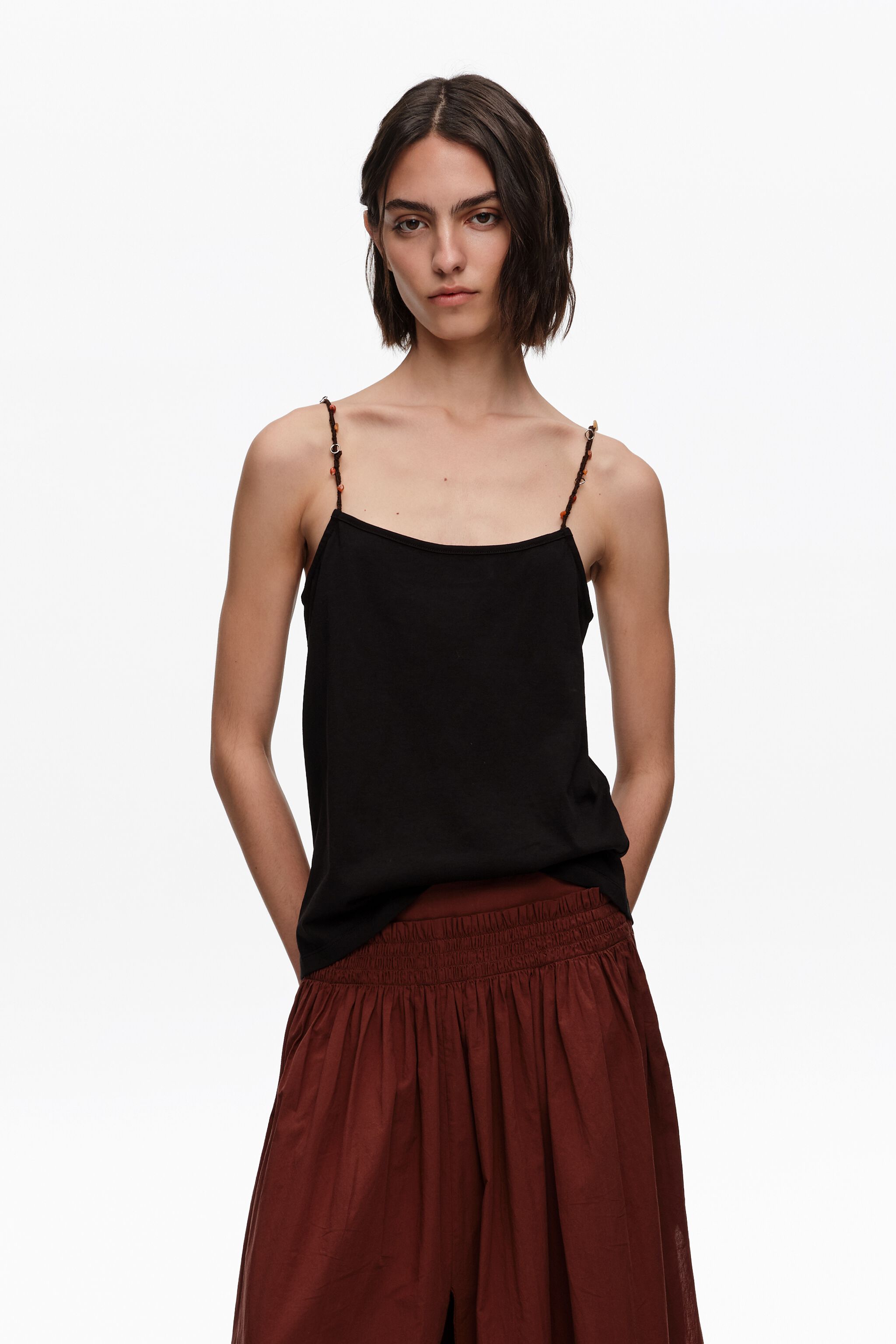 Black strappy top with decorative stones