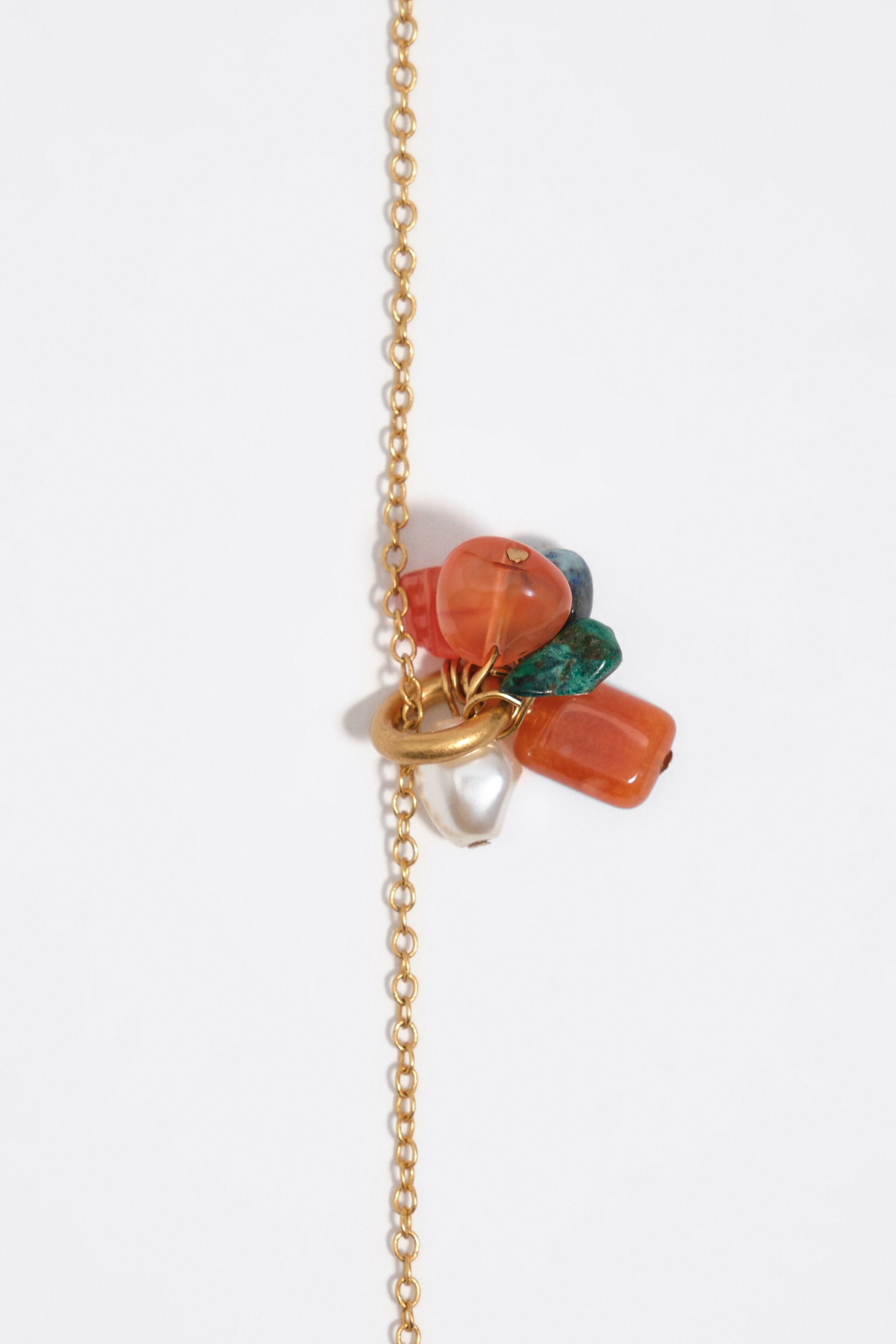 Necklace with a cluster of multicolor stones and gold pearl