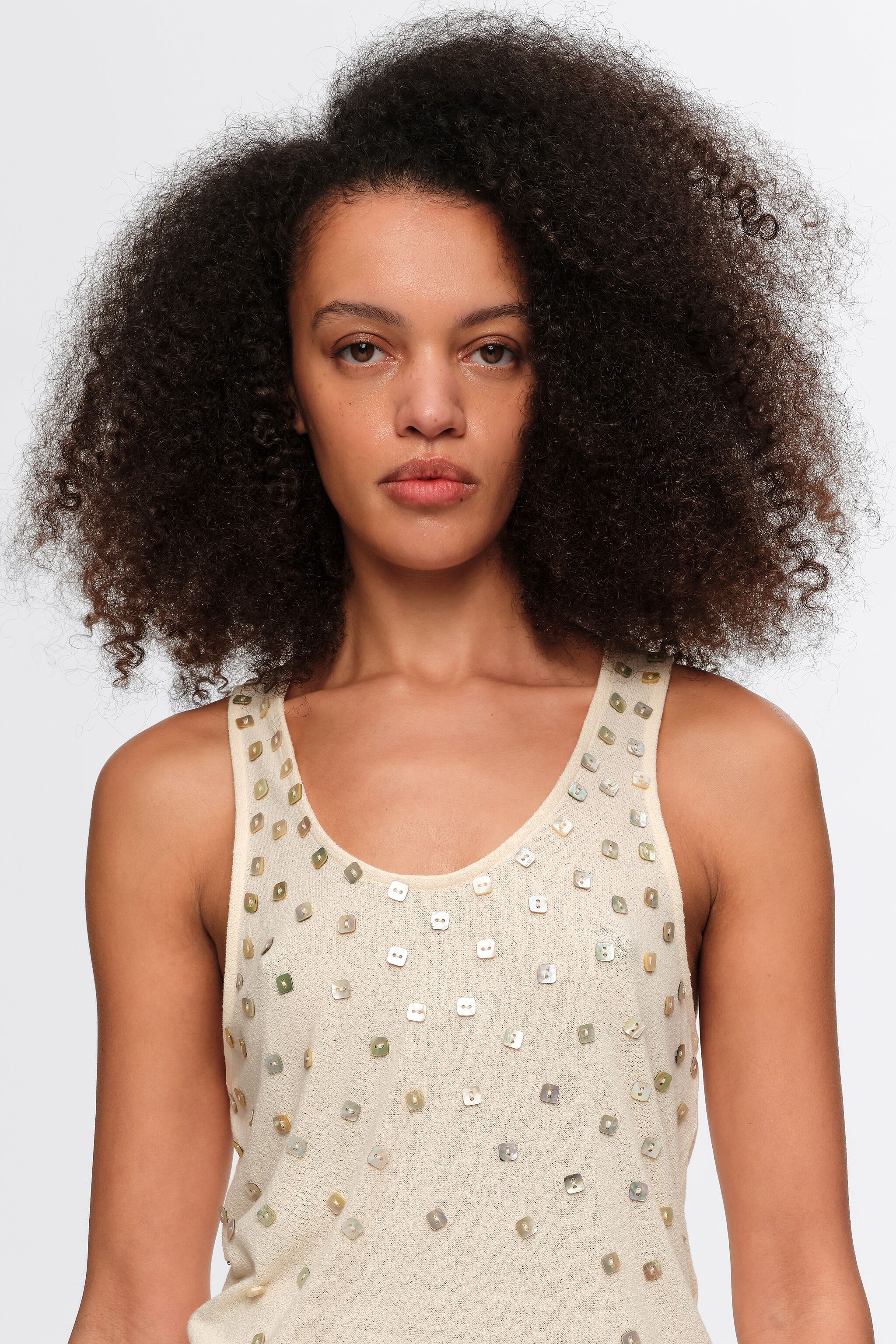 Beige top with mother-of-pearl pieces