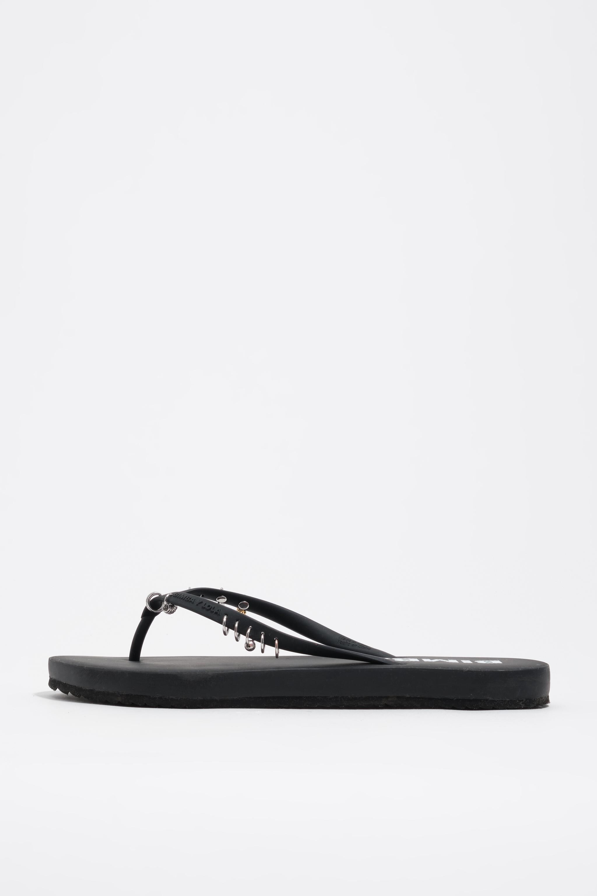 Black flip-flop with piercings