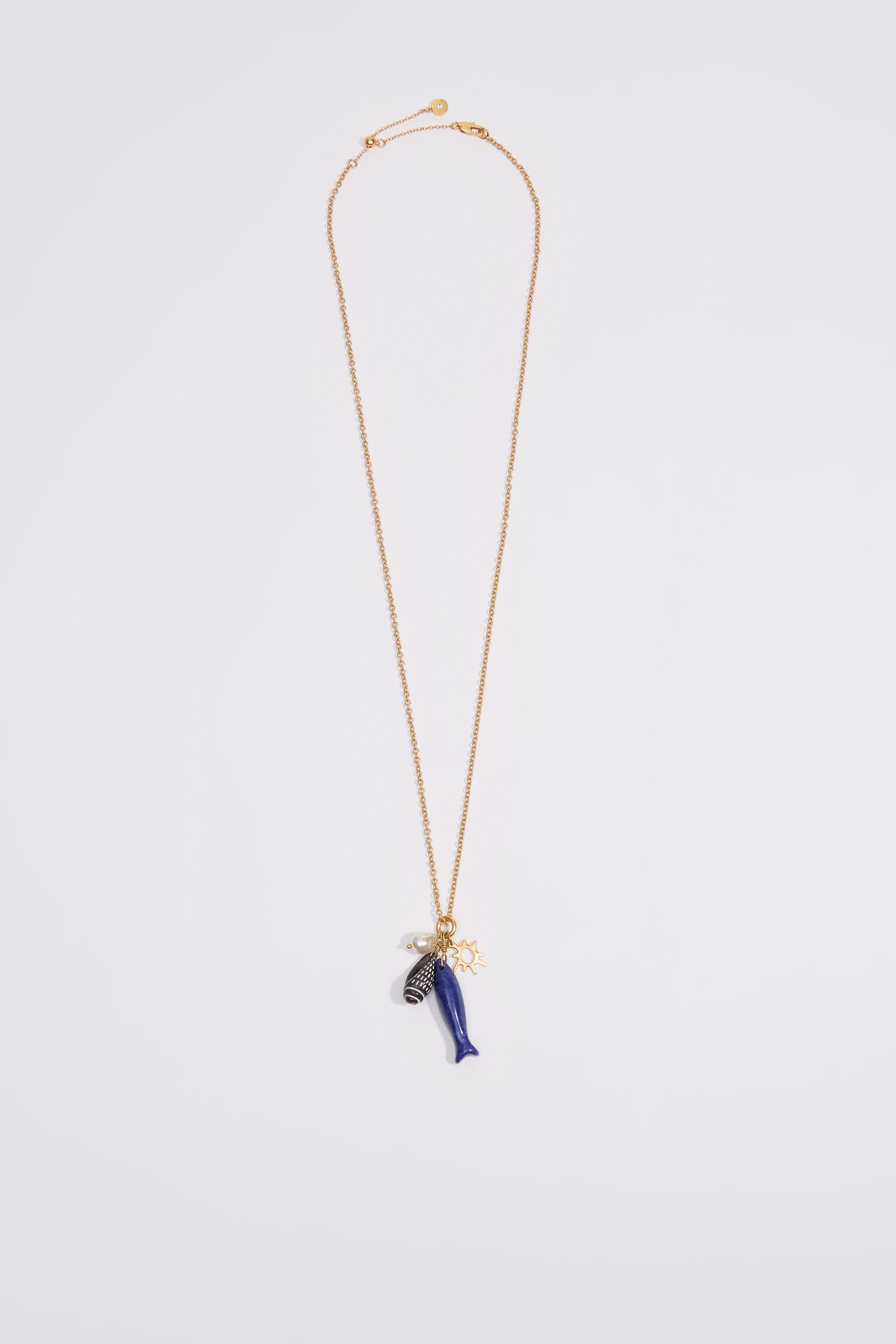 Aged gold necklace with fish and seashells