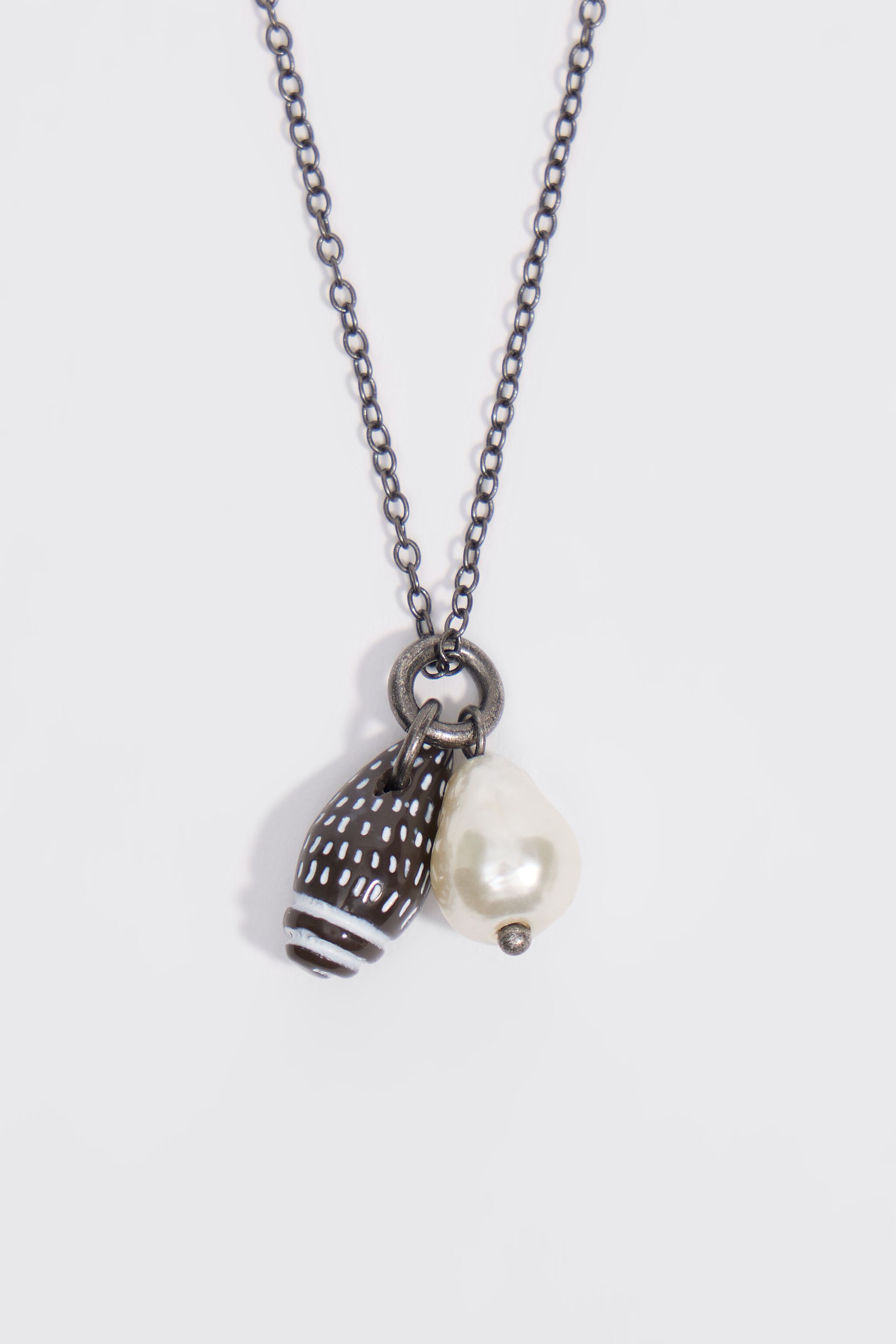 Aged silver necklace with seashell and pearl