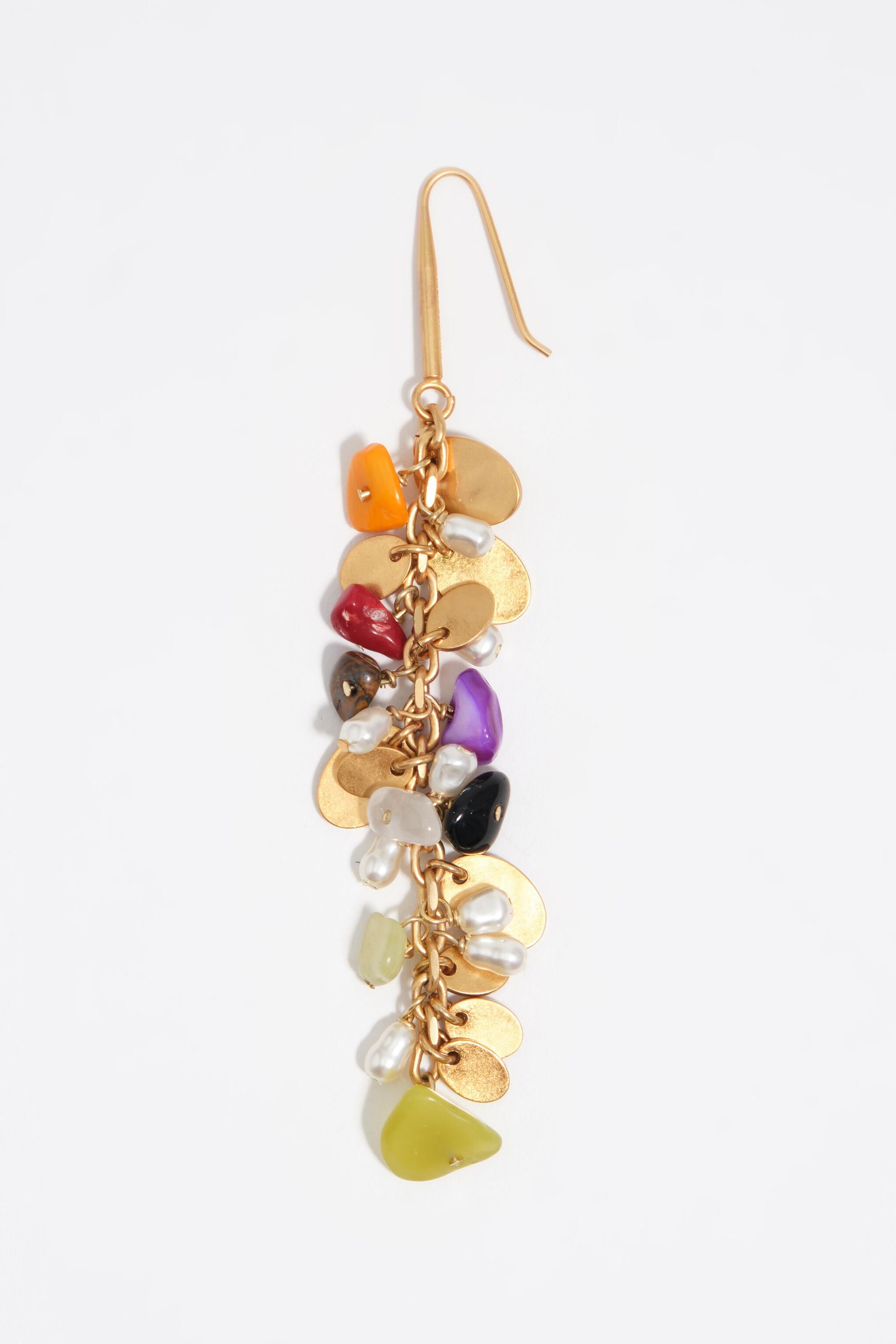 Earrings with stones and aged gold metal texture