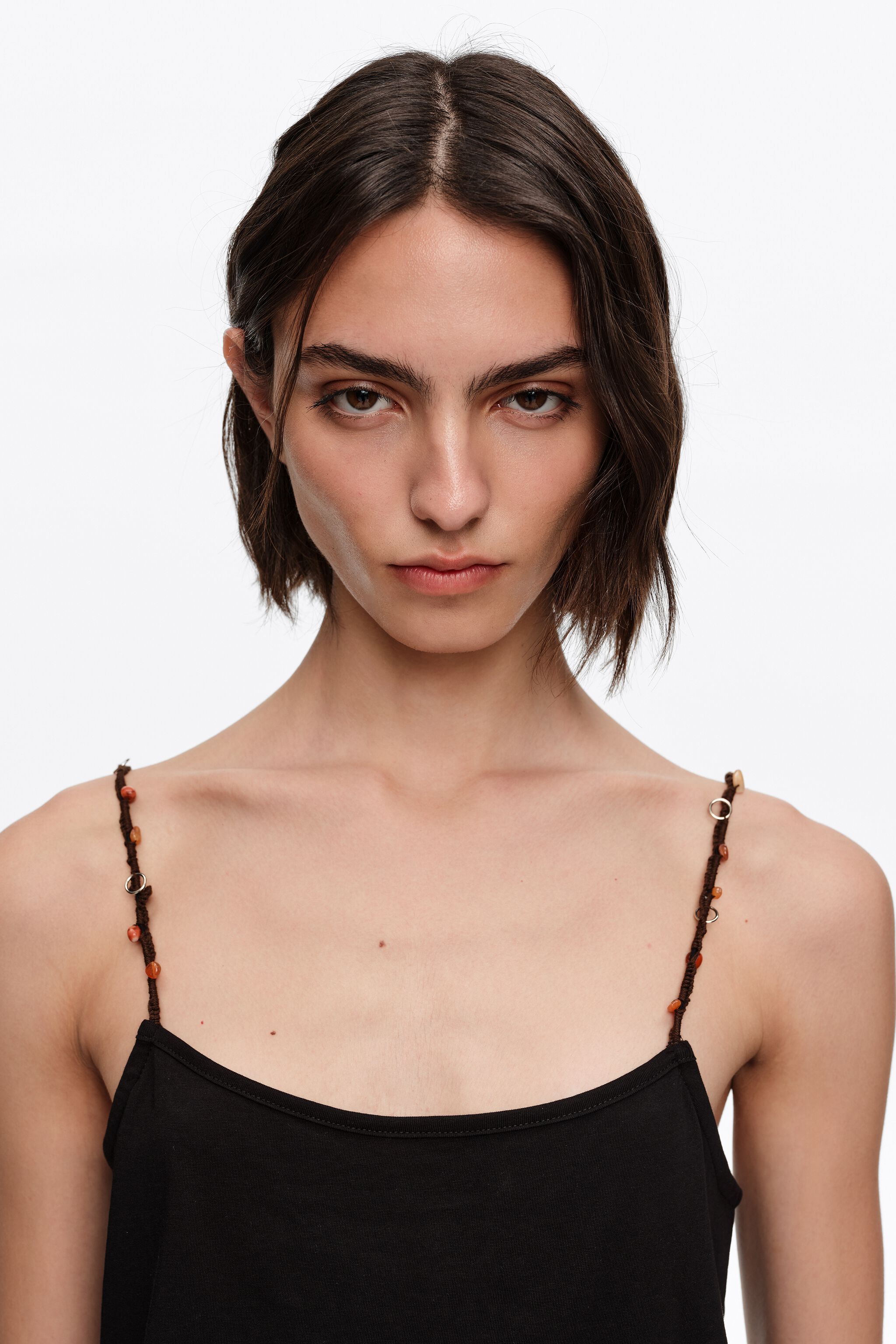 Black strappy top with decorative stones