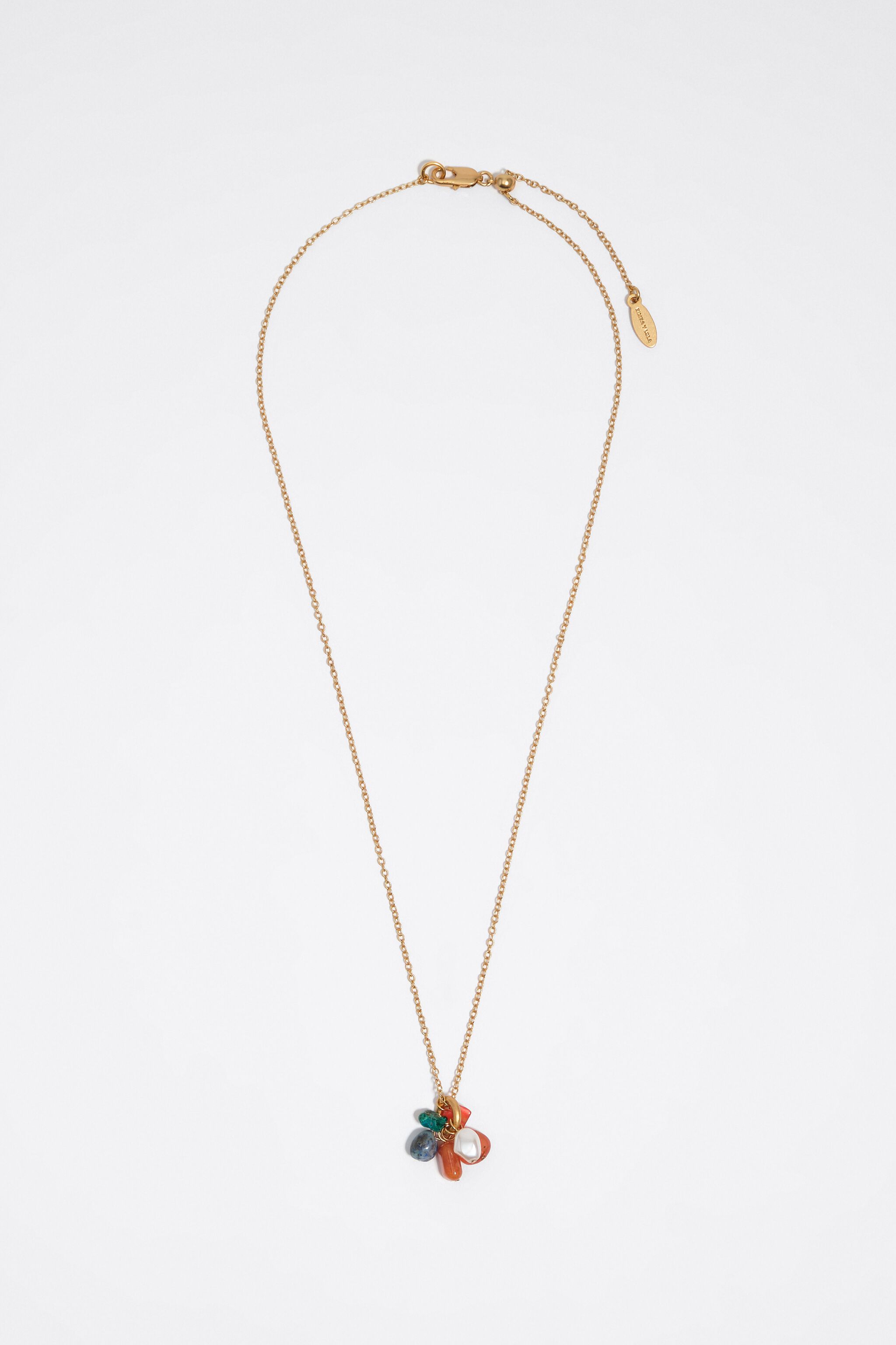 Necklace with a cluster of multicolor stones and gold pearl
