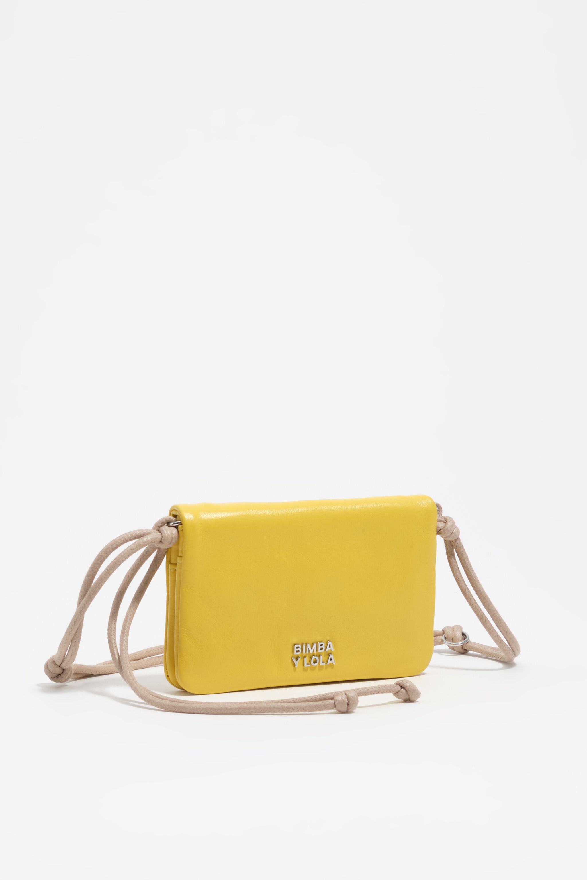 Small yellow leather flap purse