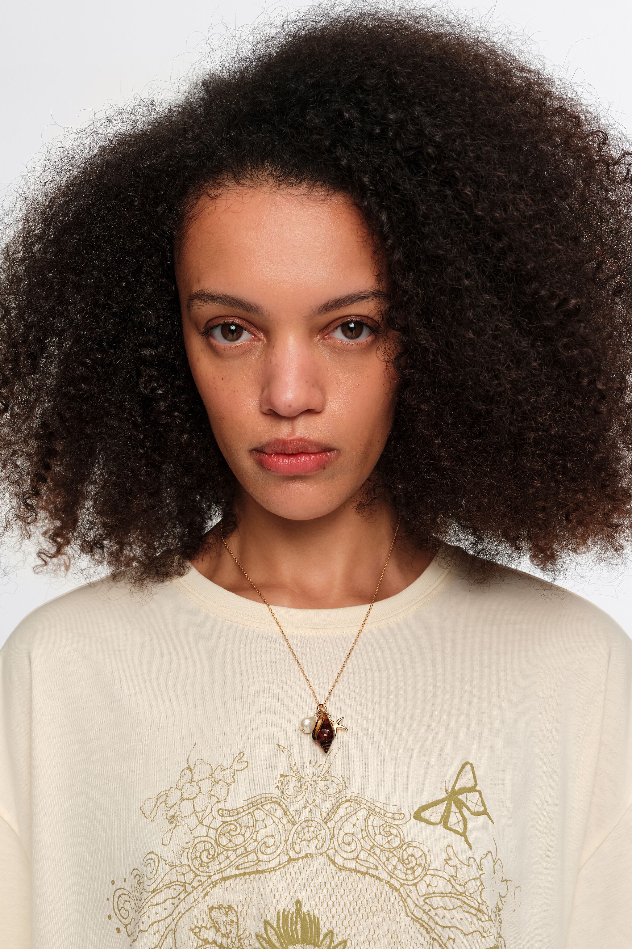 Aged gold star and shell necklace