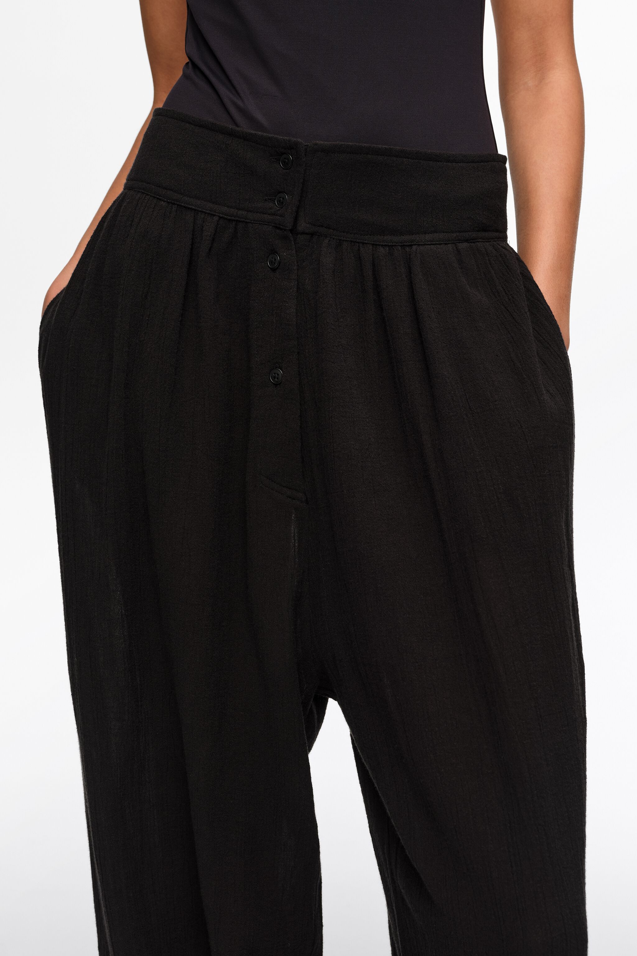 Black textured cotton harem trousers