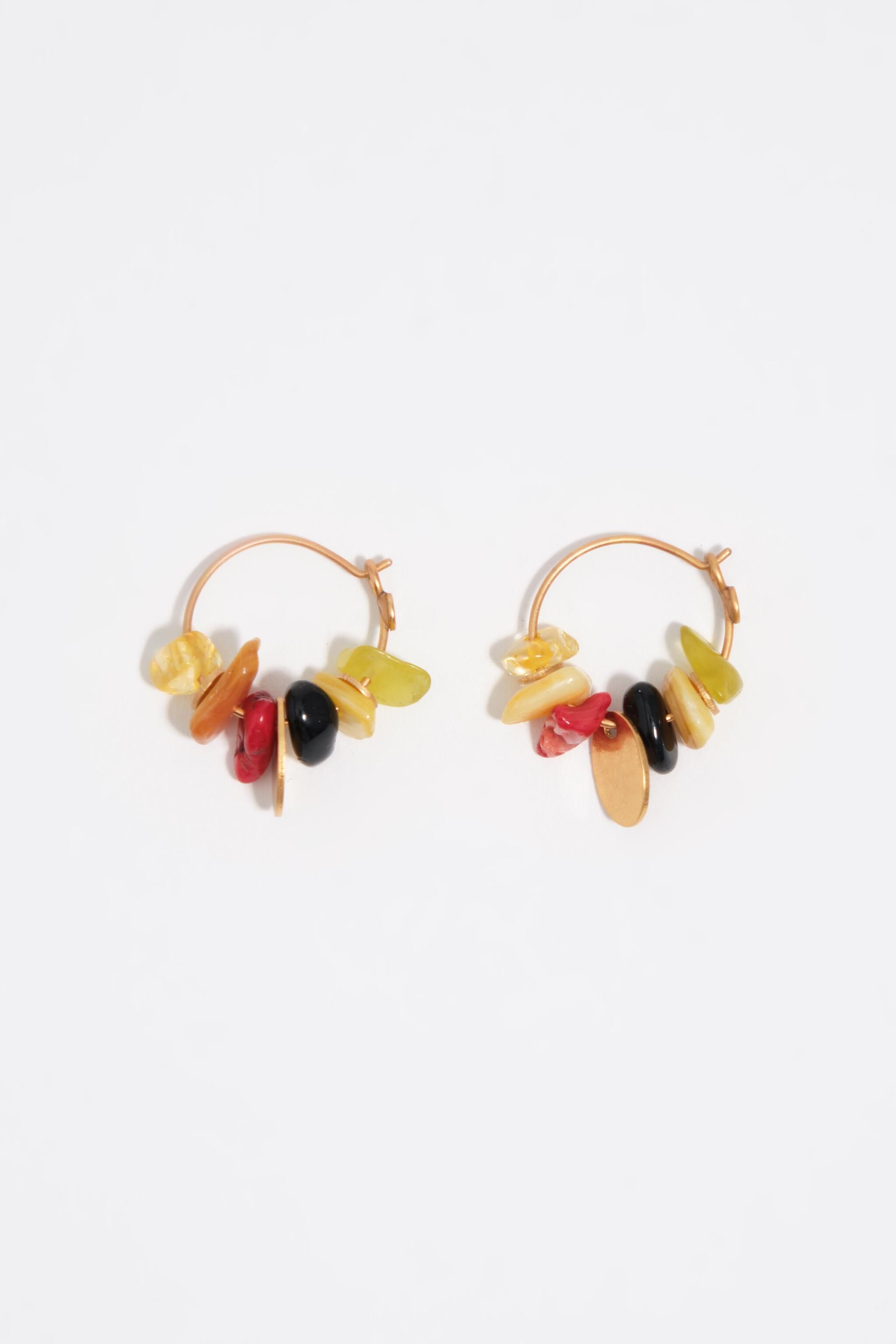 Hoop earrings with stones and aged gold metal texture