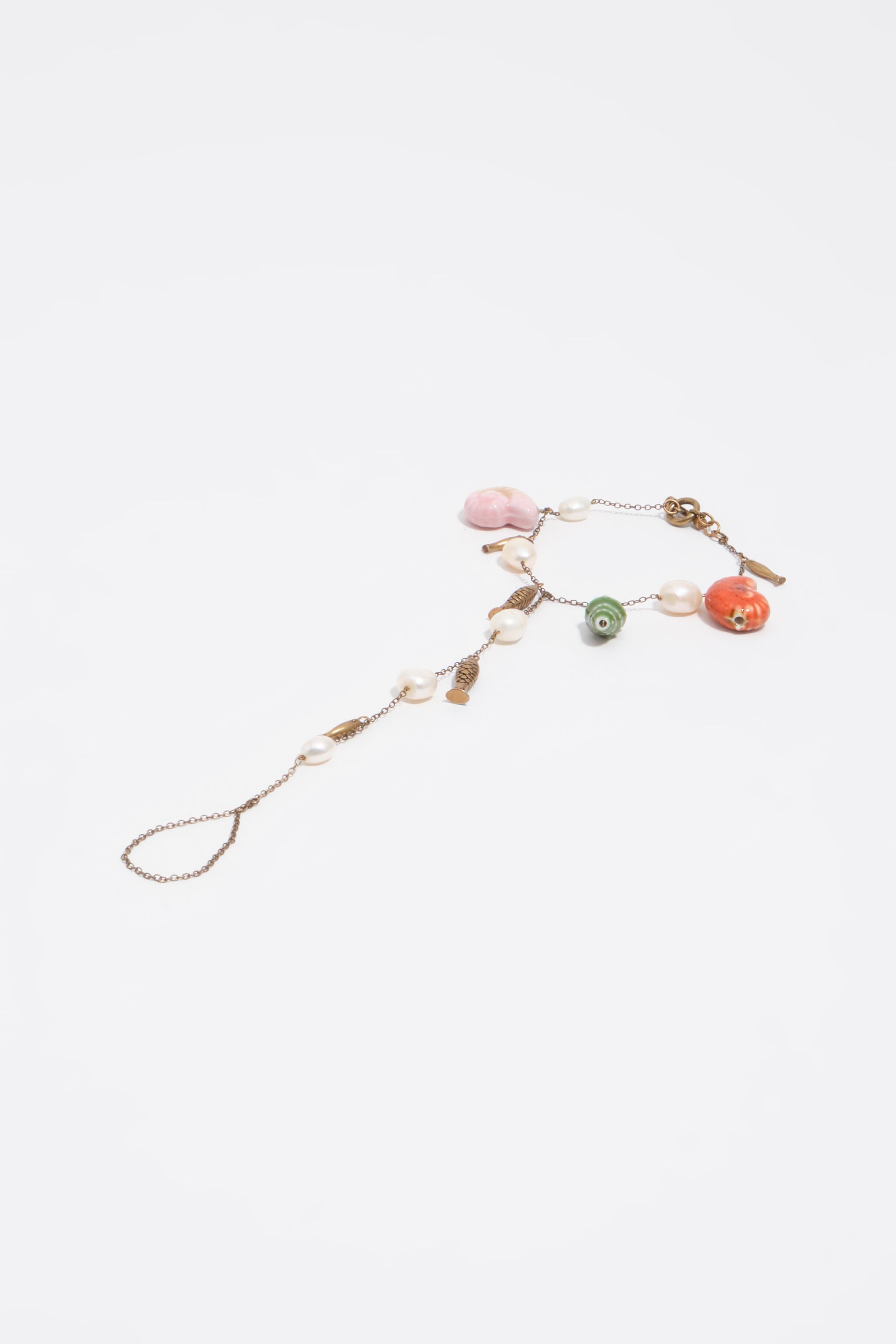 Aged gold anklet with pearls, shells and fish