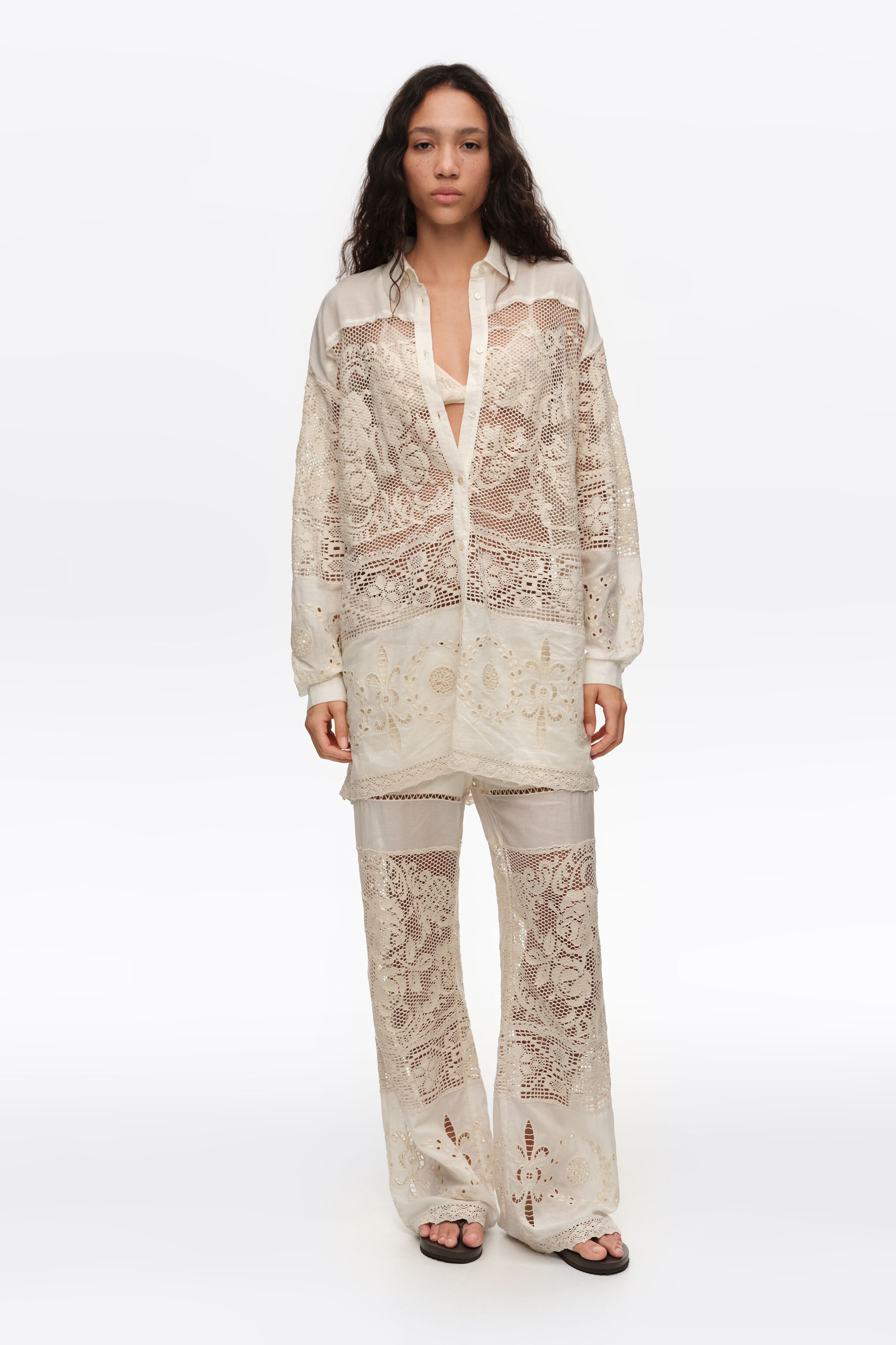 Ecru trousers with embroidery and openwork