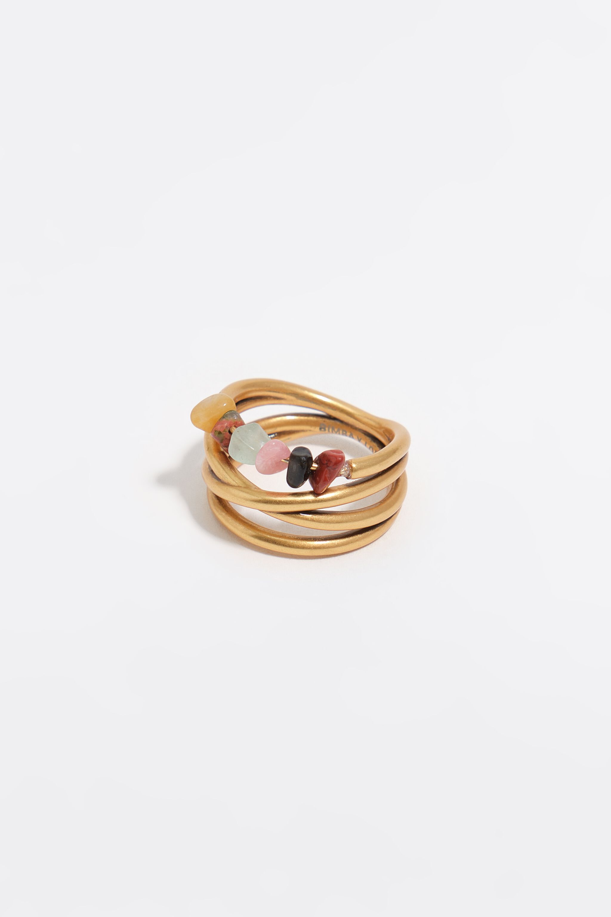 Matte gold crossed bands and stones ring