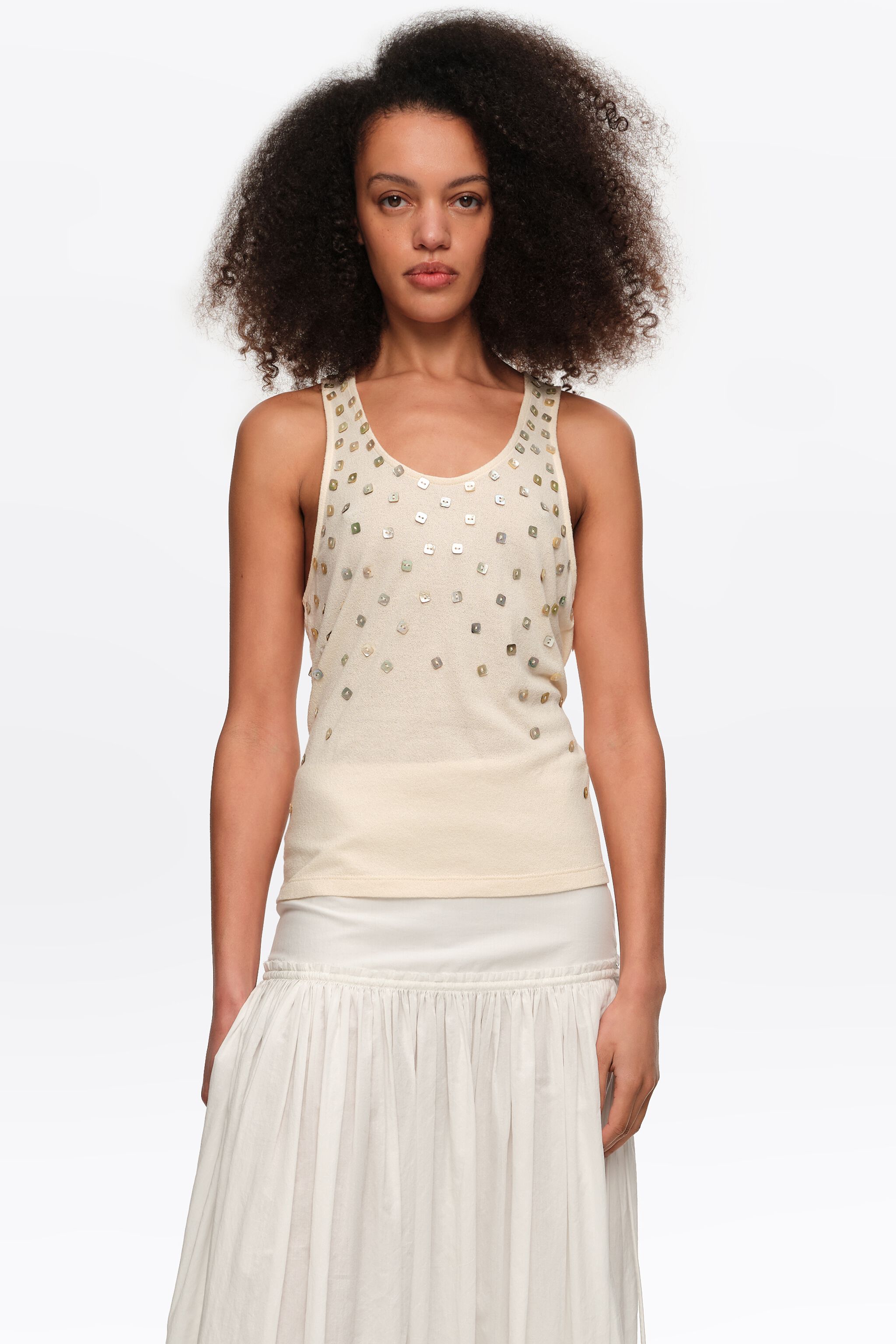 Beige top with mother-of-pearl pieces