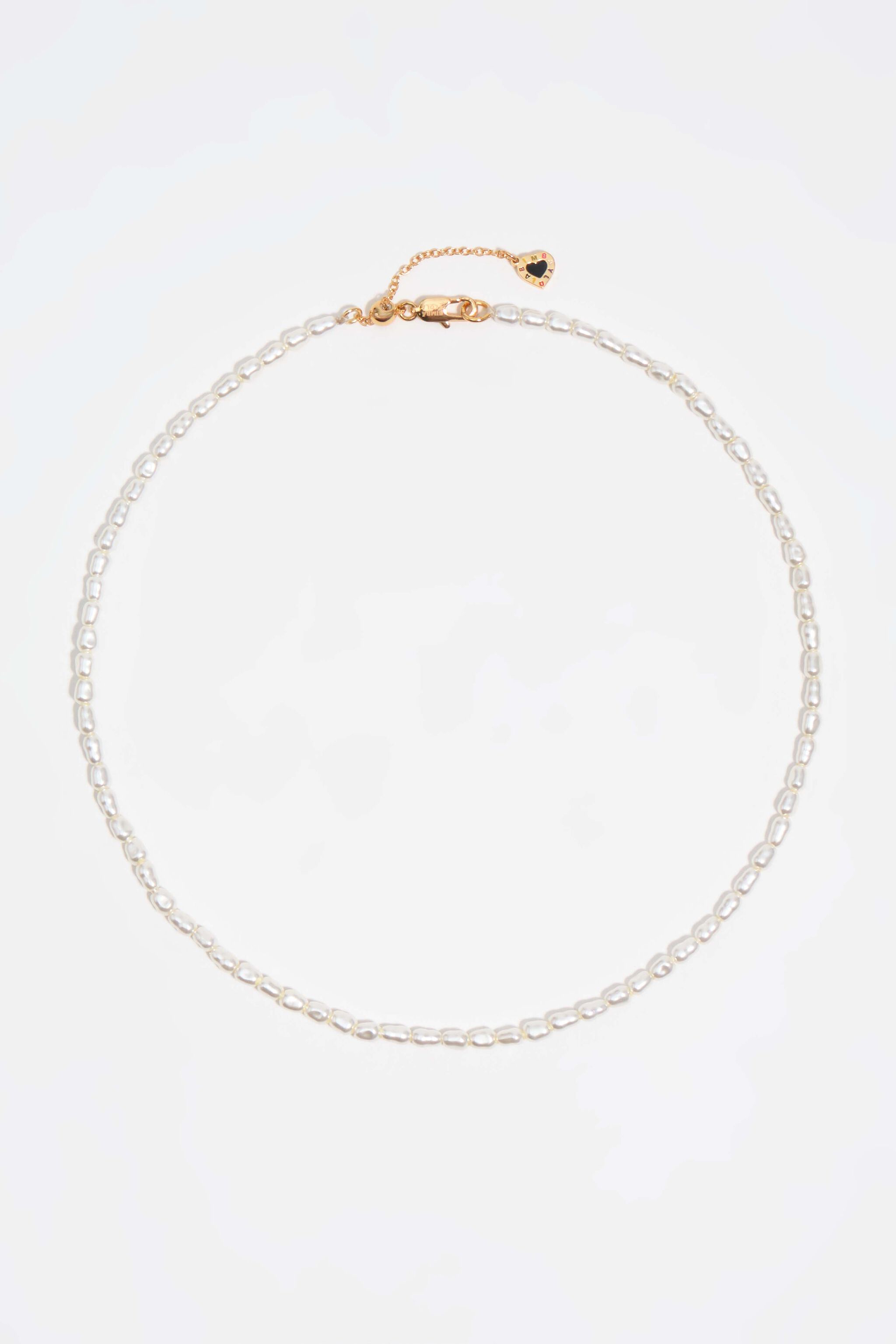 Gold chains and pearl necklace