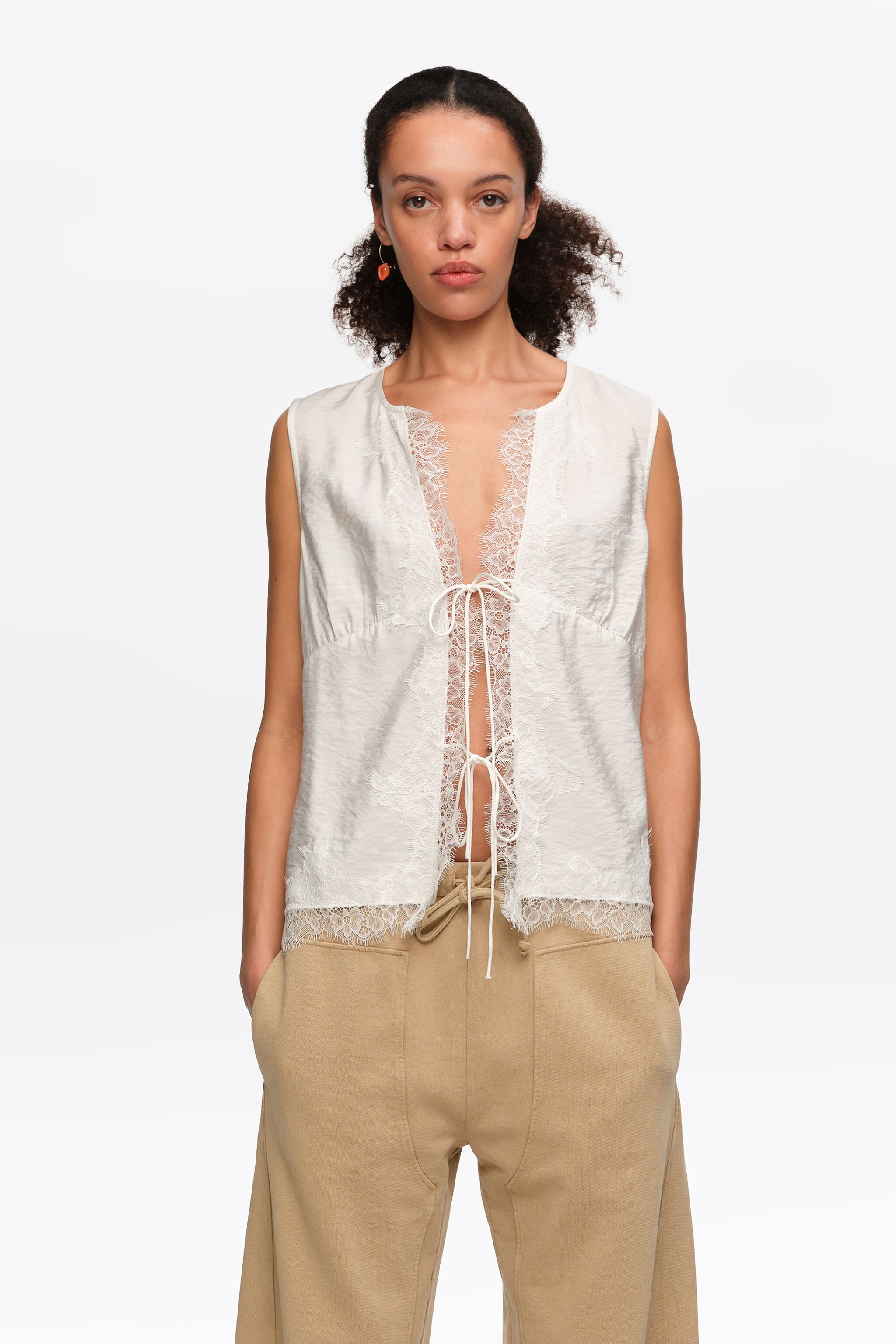 White short-sleeve shirt with lace and ties