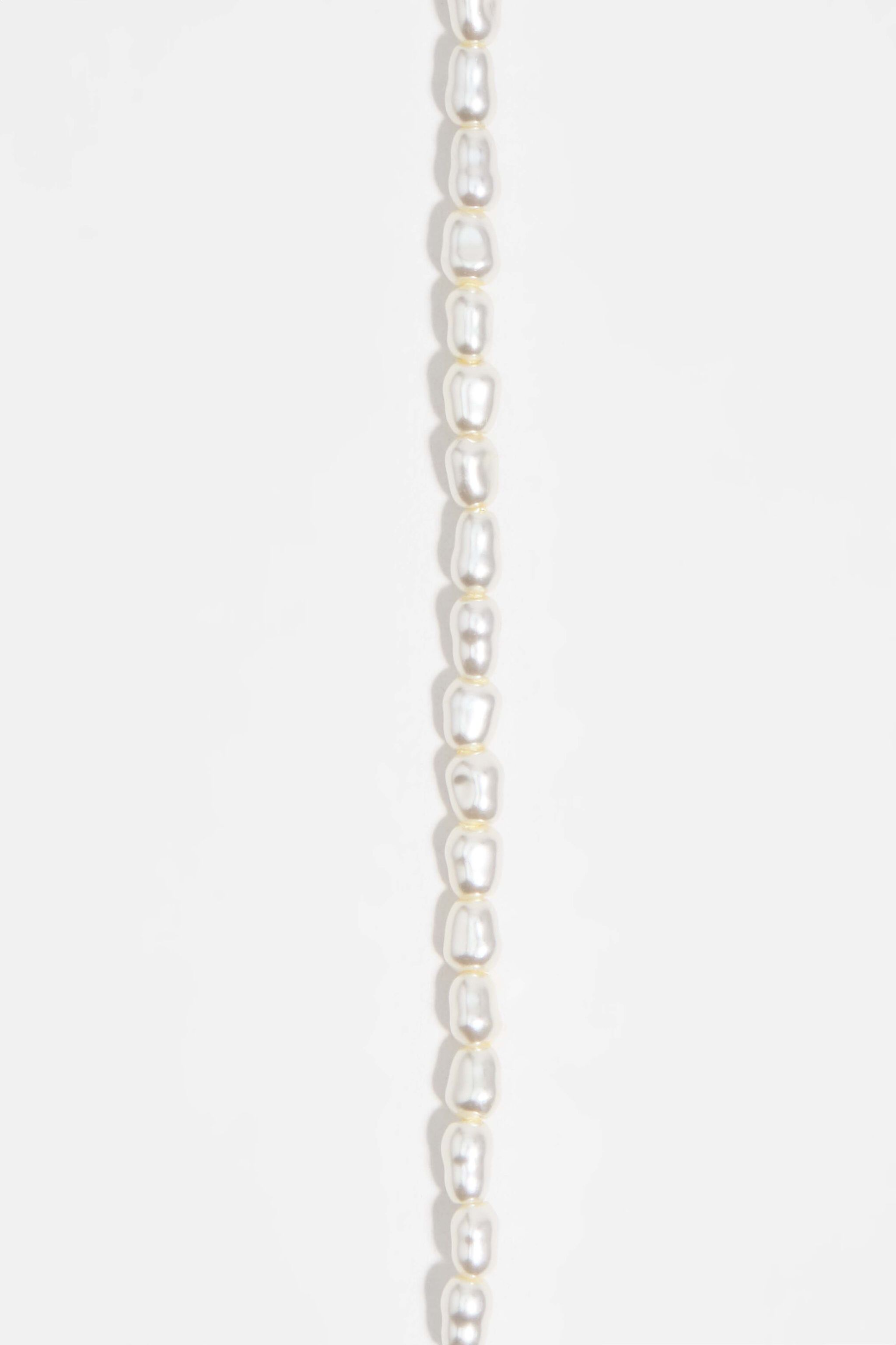 Gold chains and pearl necklace