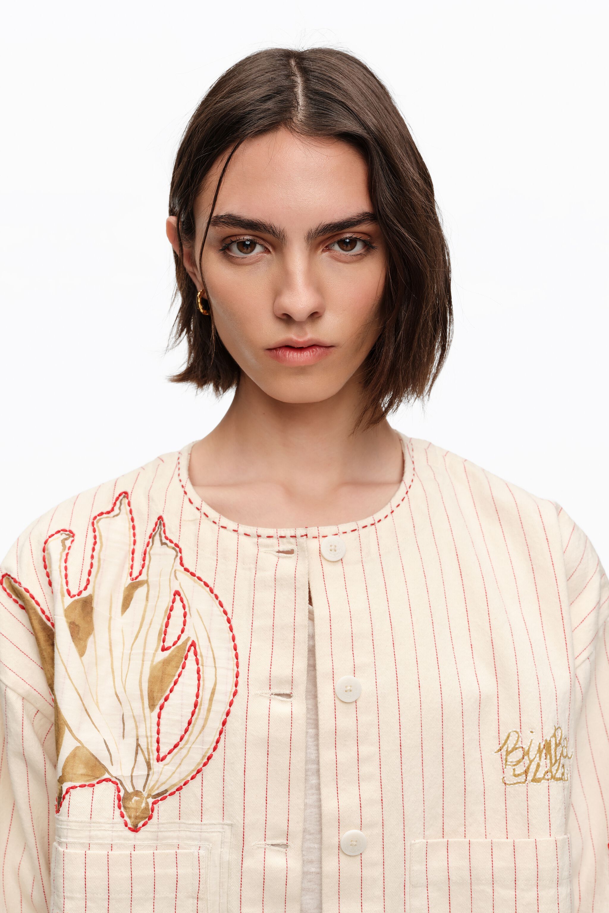 Ivory jacket with stitching and striped prints