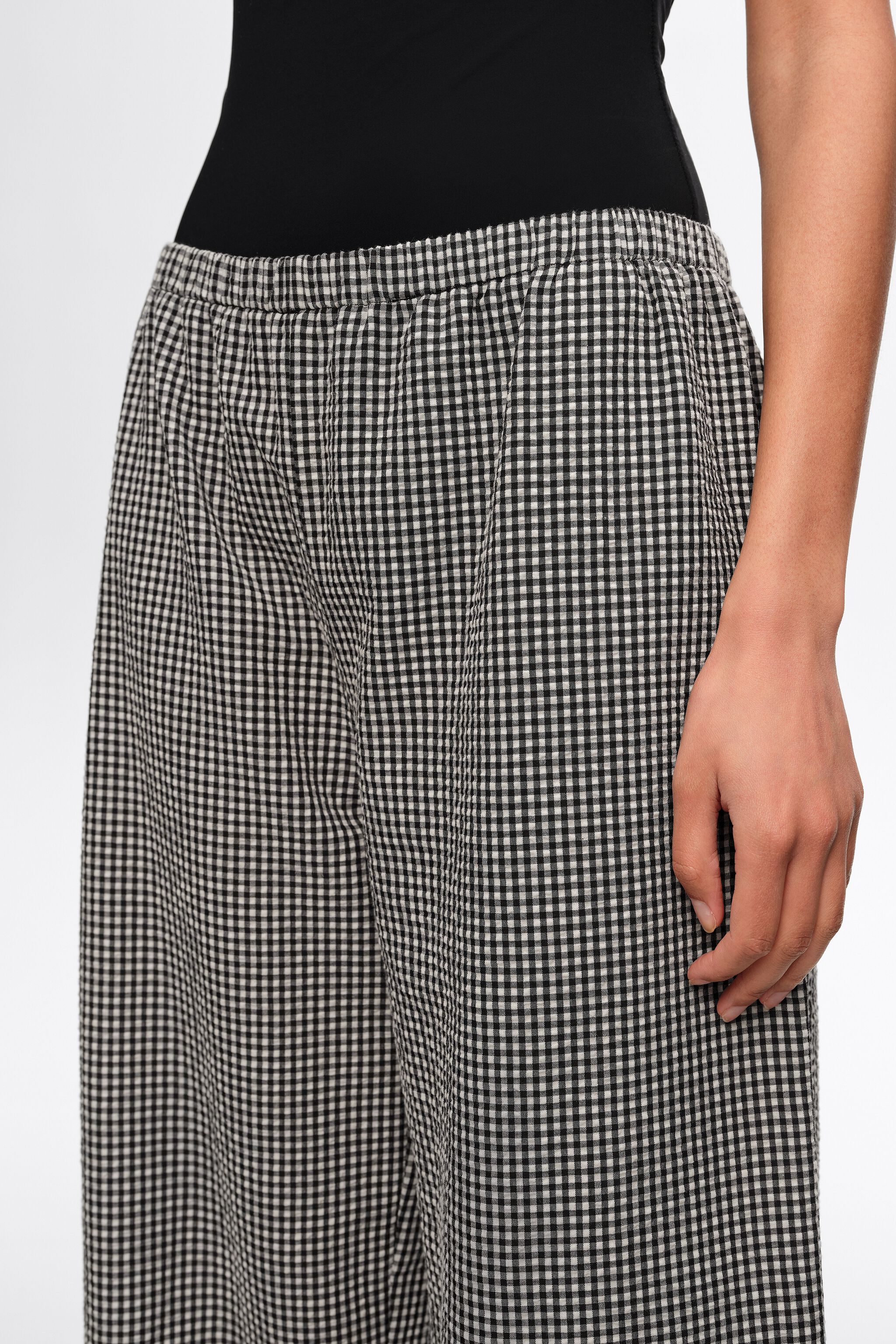 Black checked trousers with adjustable ankles