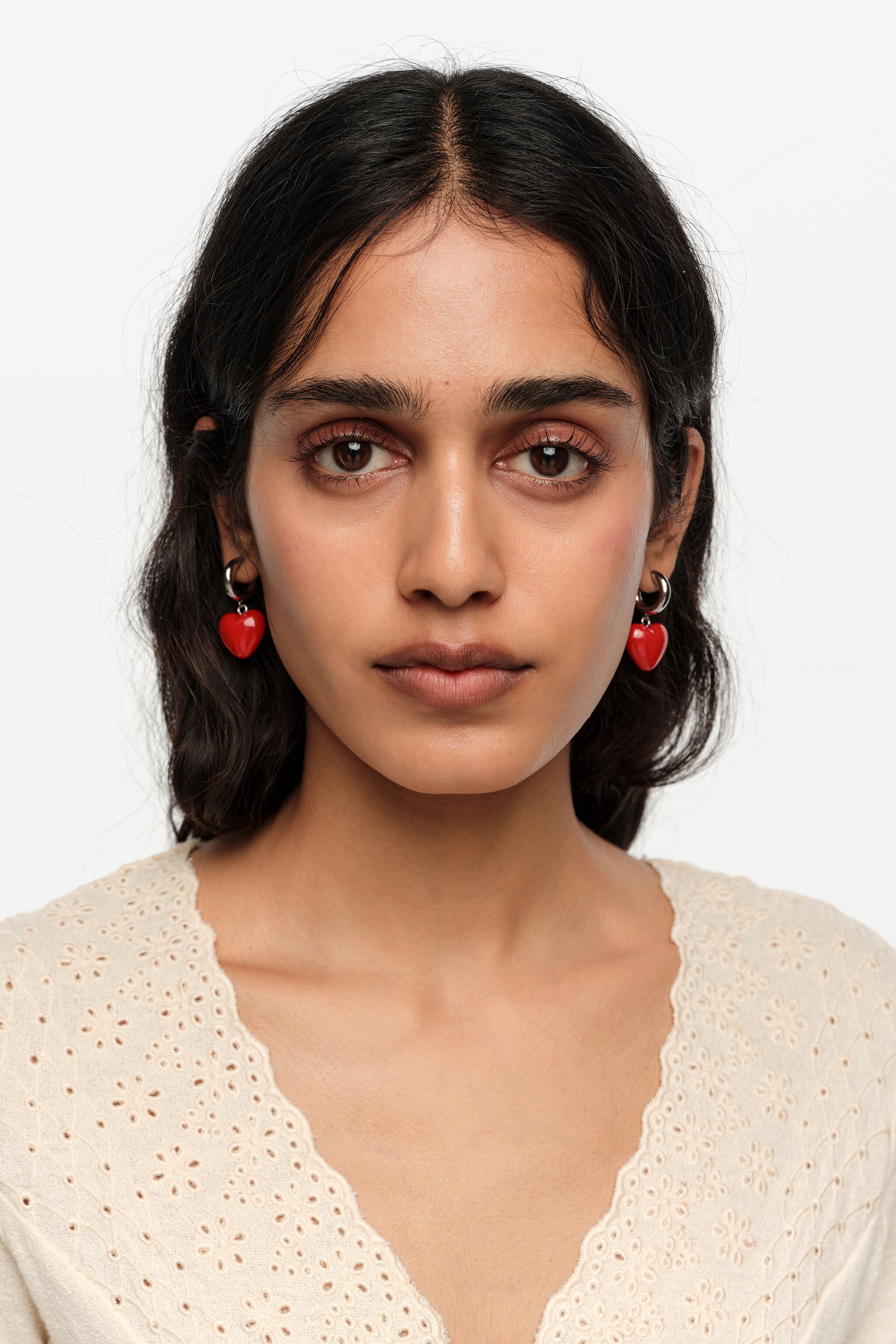 Silver hoop earrings and red heart